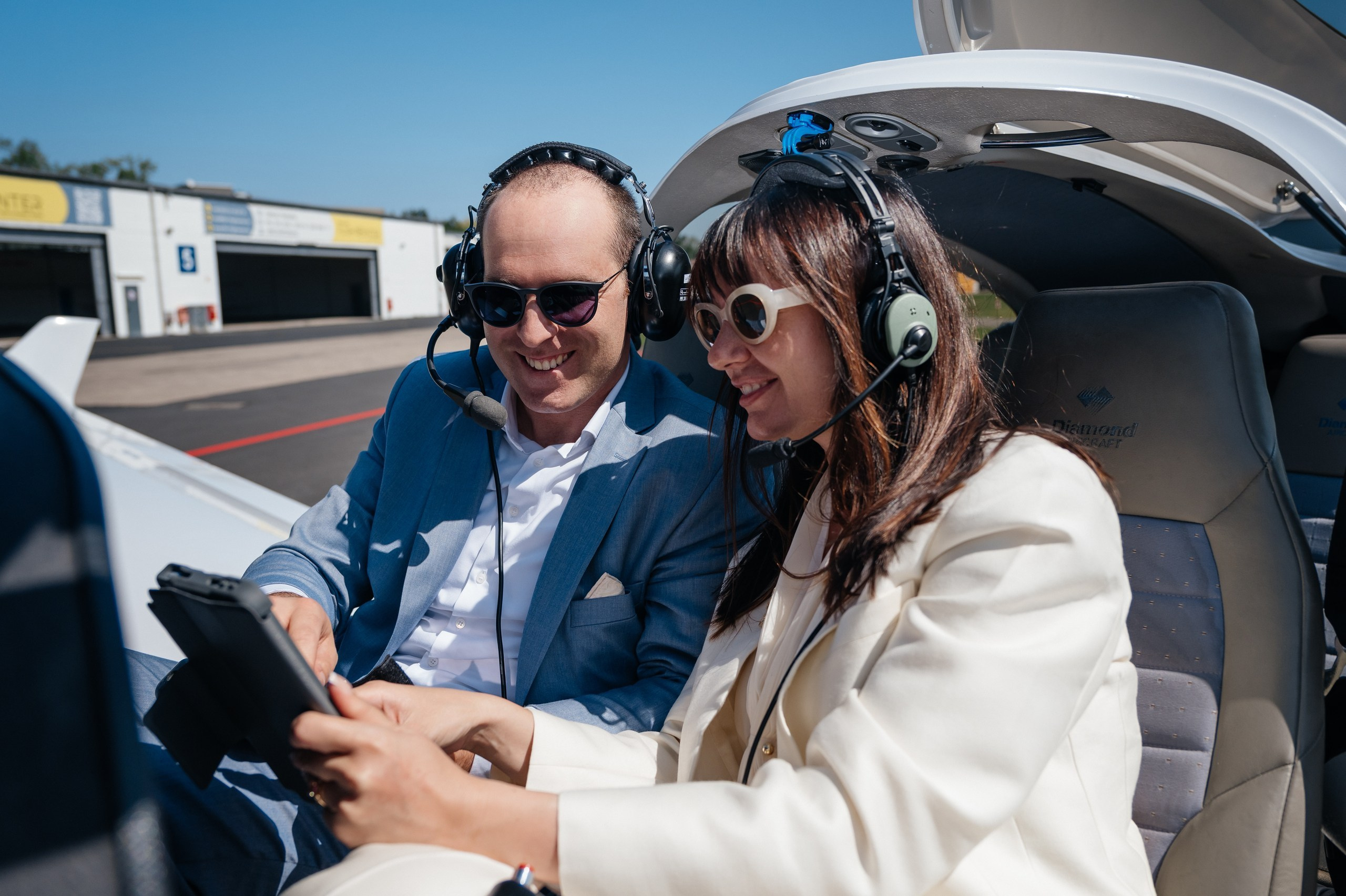 couple looks the route of the roundtrip by airplane