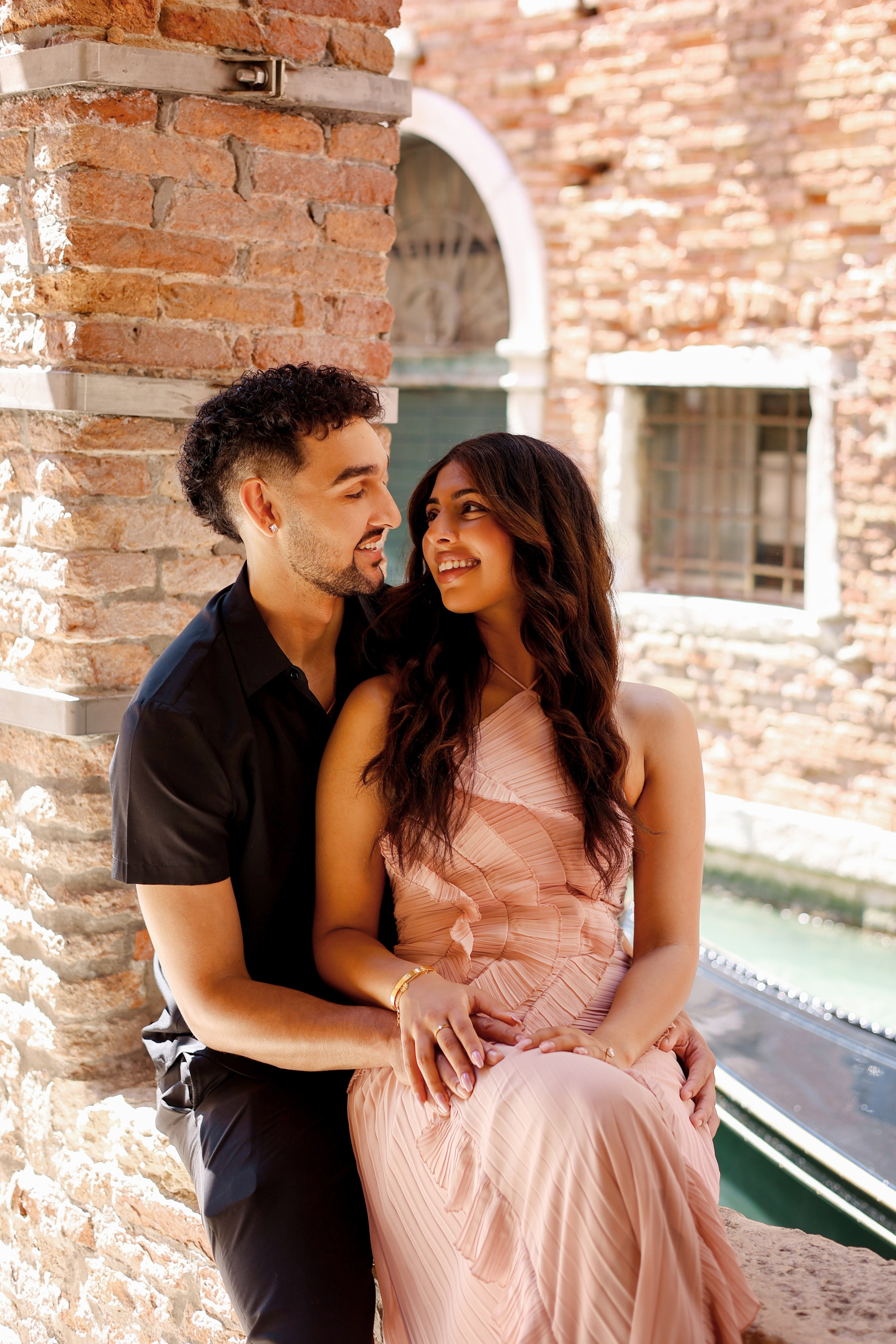 Elegant couple portrait in Venice canals
