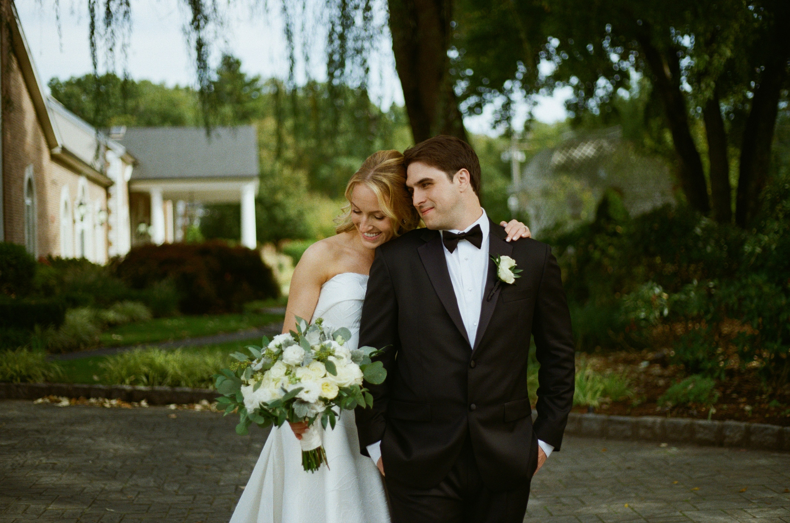 Emily and Michael sharing a quiet moment during their outdoor wedding portraits