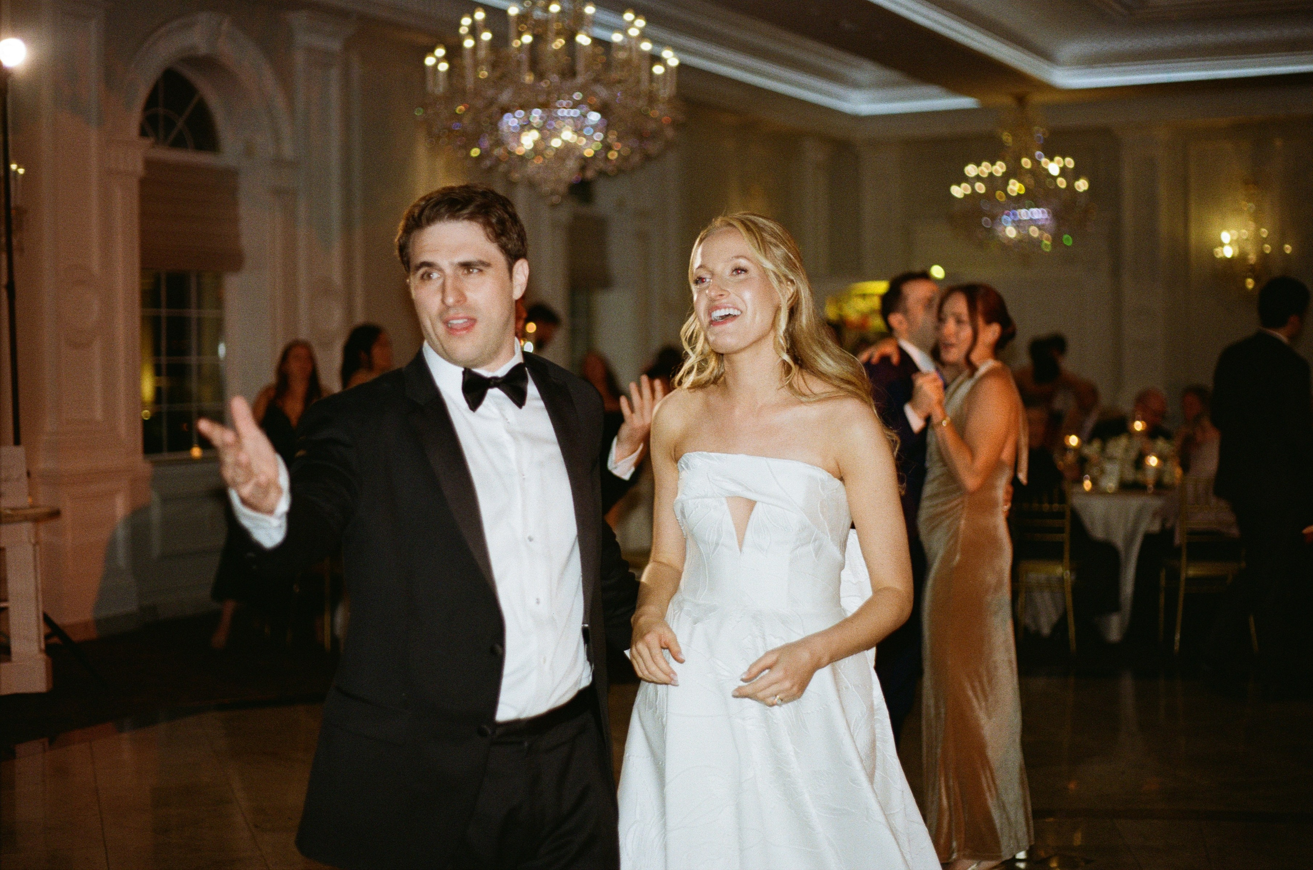 Emily and Michael celebrating together during their elegant wedding reception