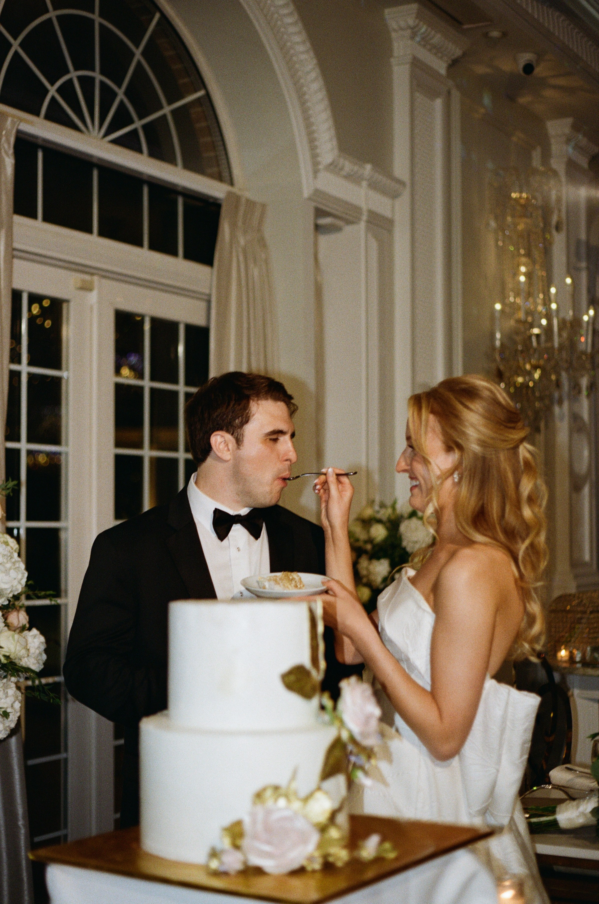 Close-up of the newlyweds cutting their wedding cake at The Rockleigh