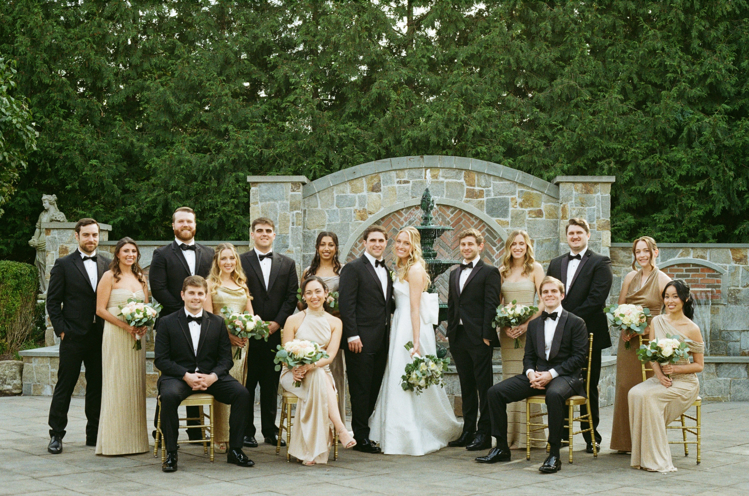 Emily and Michael with their wedding party in the gardens at The Rockleigh