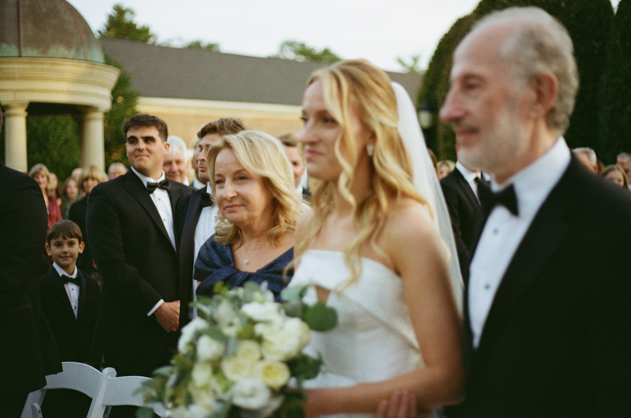 Candid moment with Emily and wedding guests during the outdoor celebration