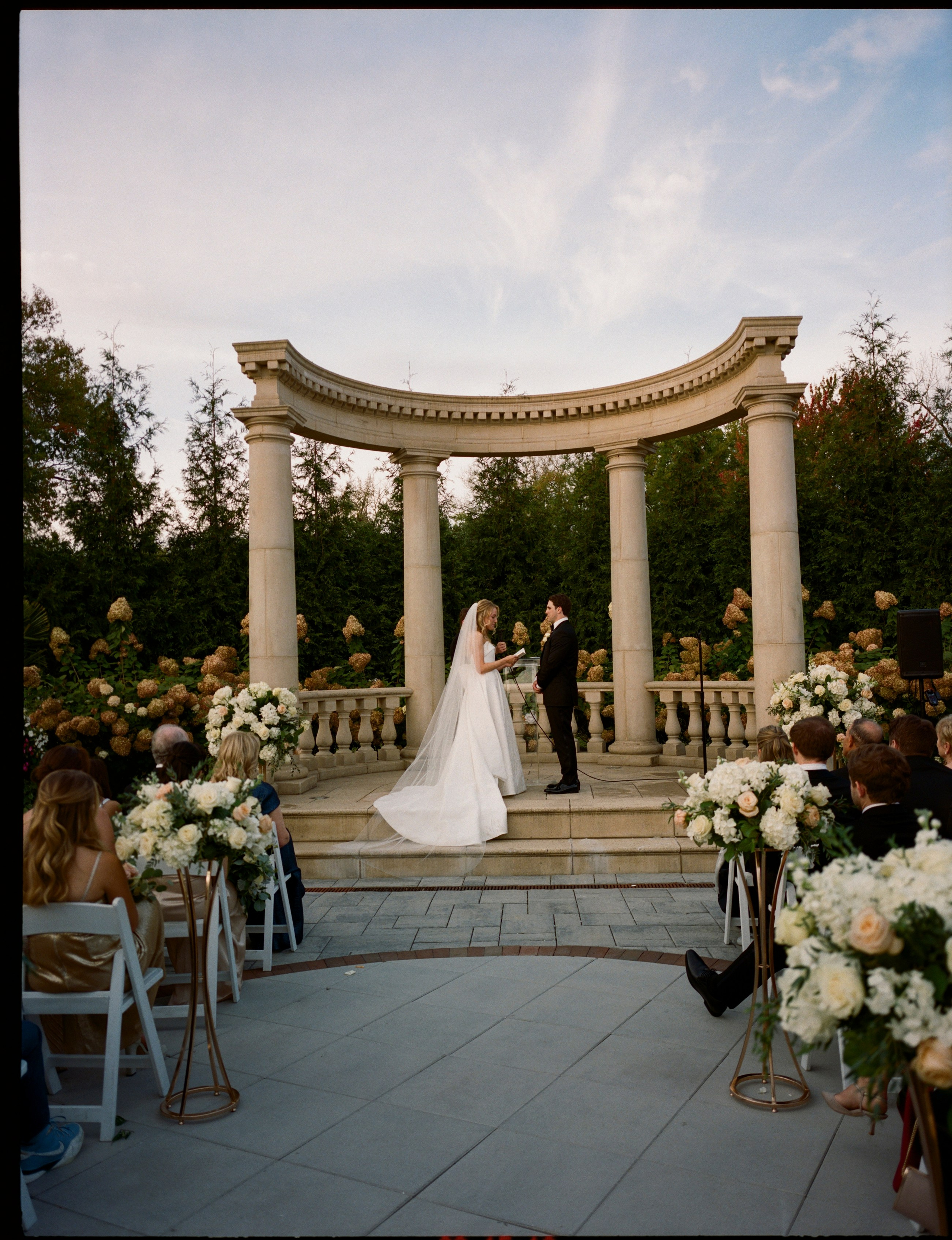 Outdoor wedding ceremony setting beneath the garden pavilion at The Rockleigh in New Jersey