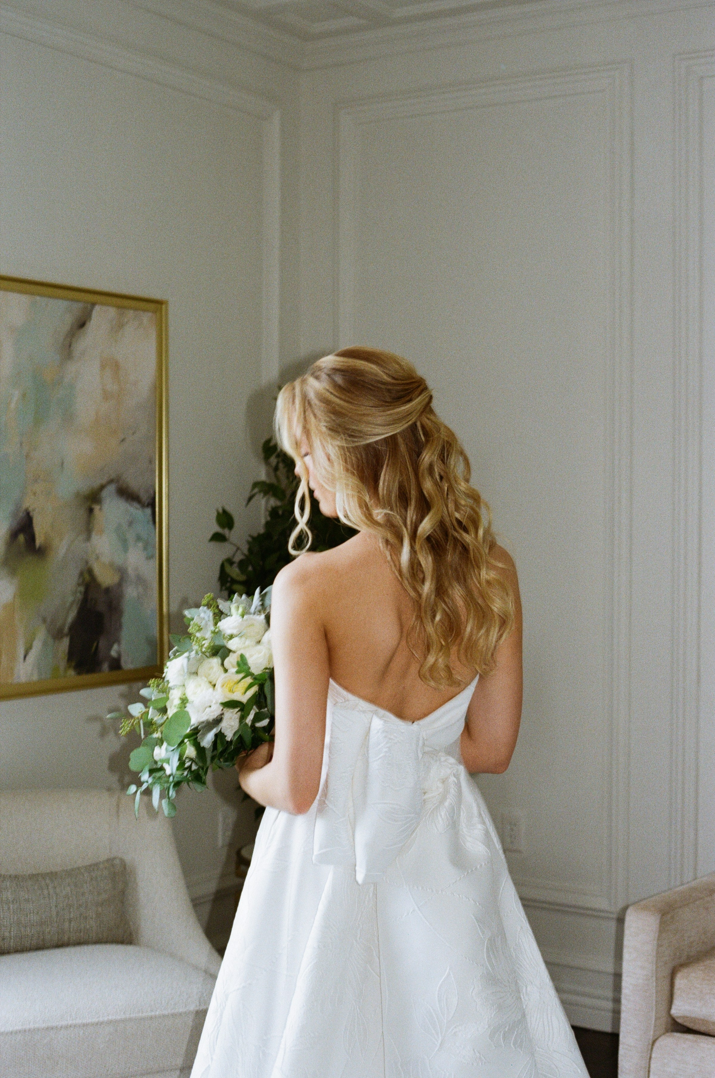 Emily holding her bridal bouquet before the wedding at The Rockleigh