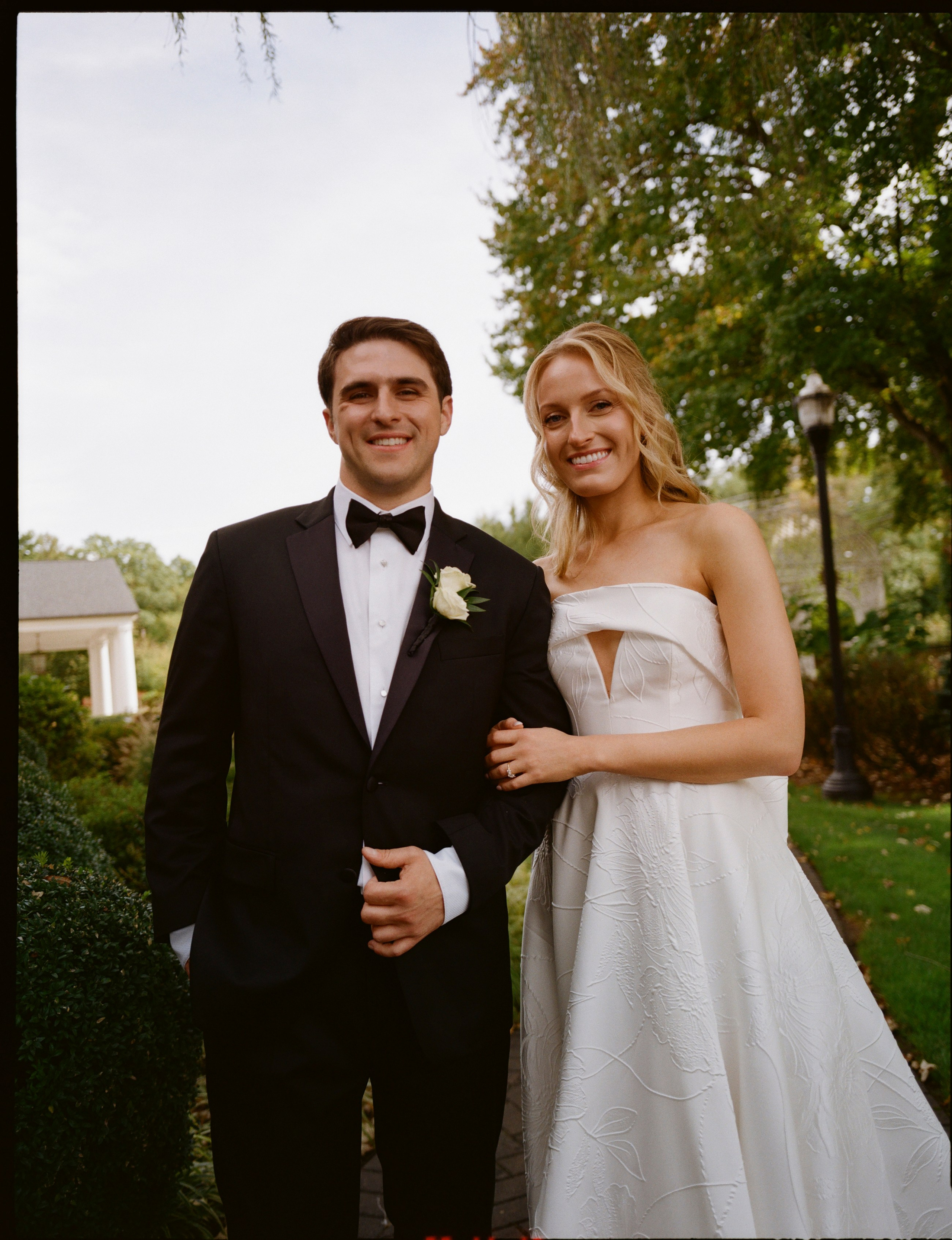 Classic film wedding portrait of Emily and Michael in the gardens