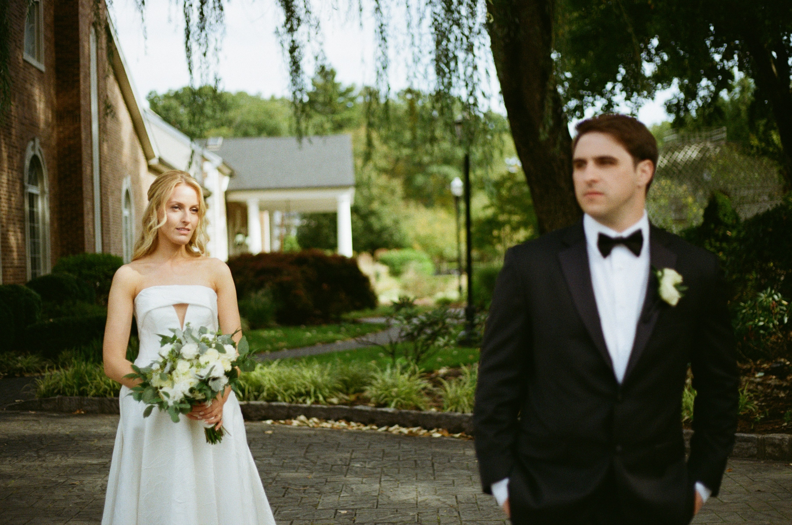 Editorial portraits of Emily and Michael in the gardens at The Rockleigh