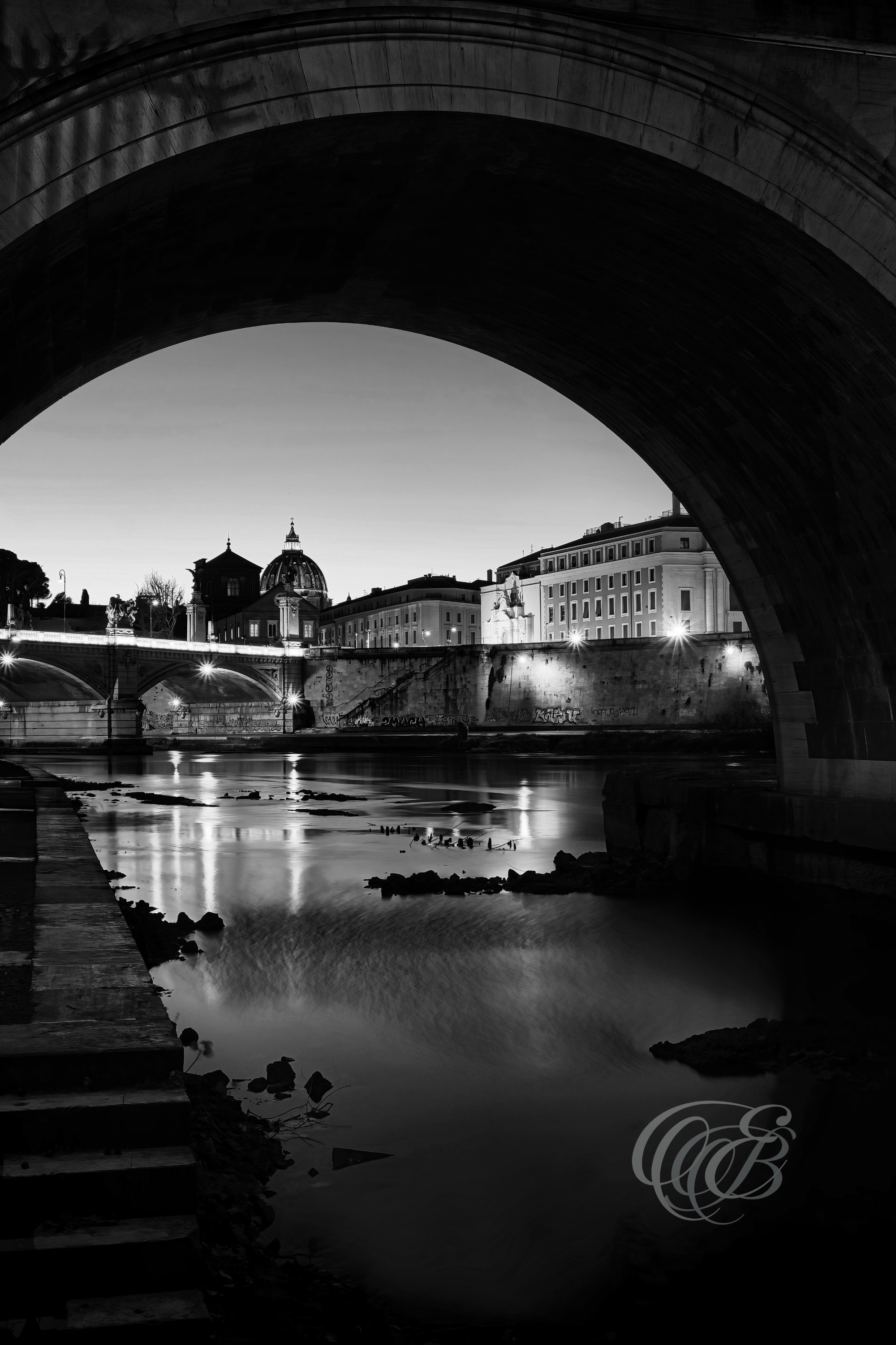 Rome Italy - Sunset under The Ponte Sant'Angelo - B&W - Eduardo Bartoli Fine Art Photography - Black and white photograph of the sunset under Ponte Sant'Angelo in Rome, Italy – fine art photography by Eduardo Bartoli.
