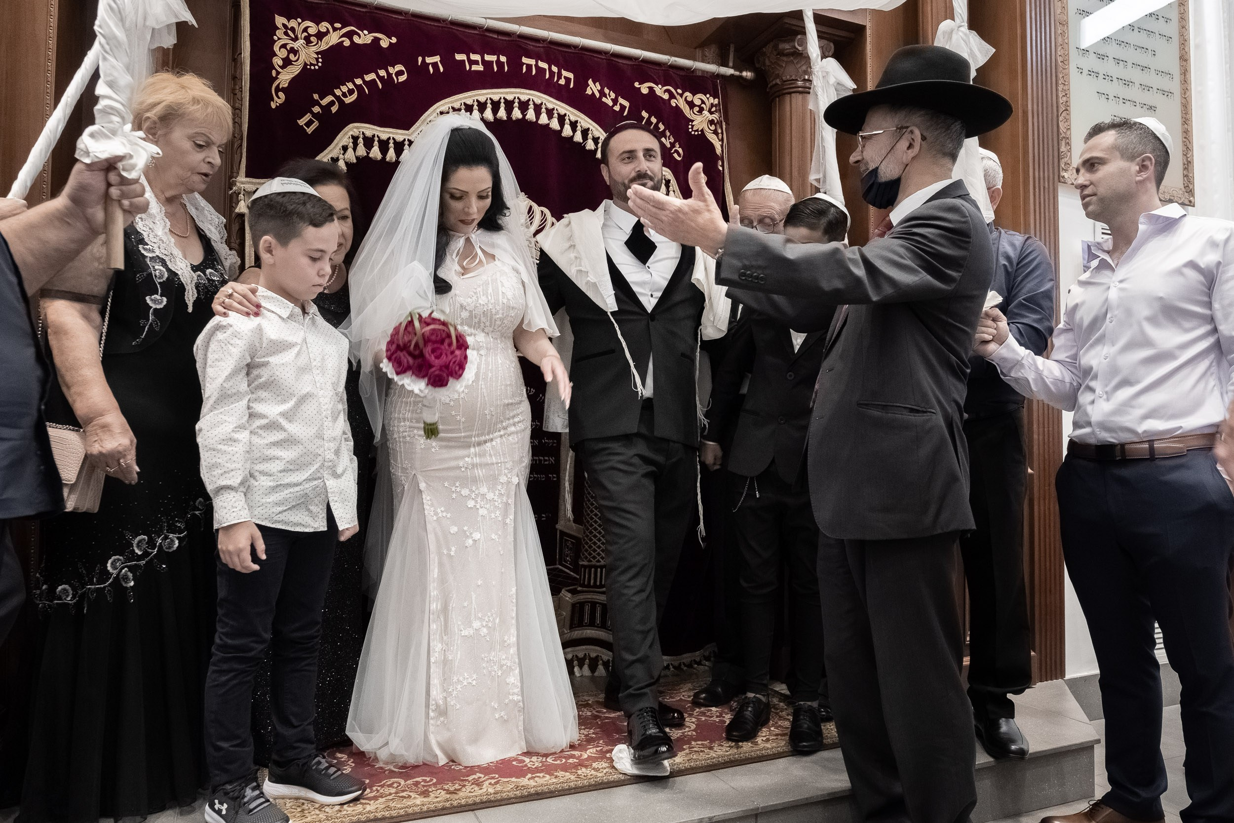 Emil breaks the glass at the end of the wedding ceremony