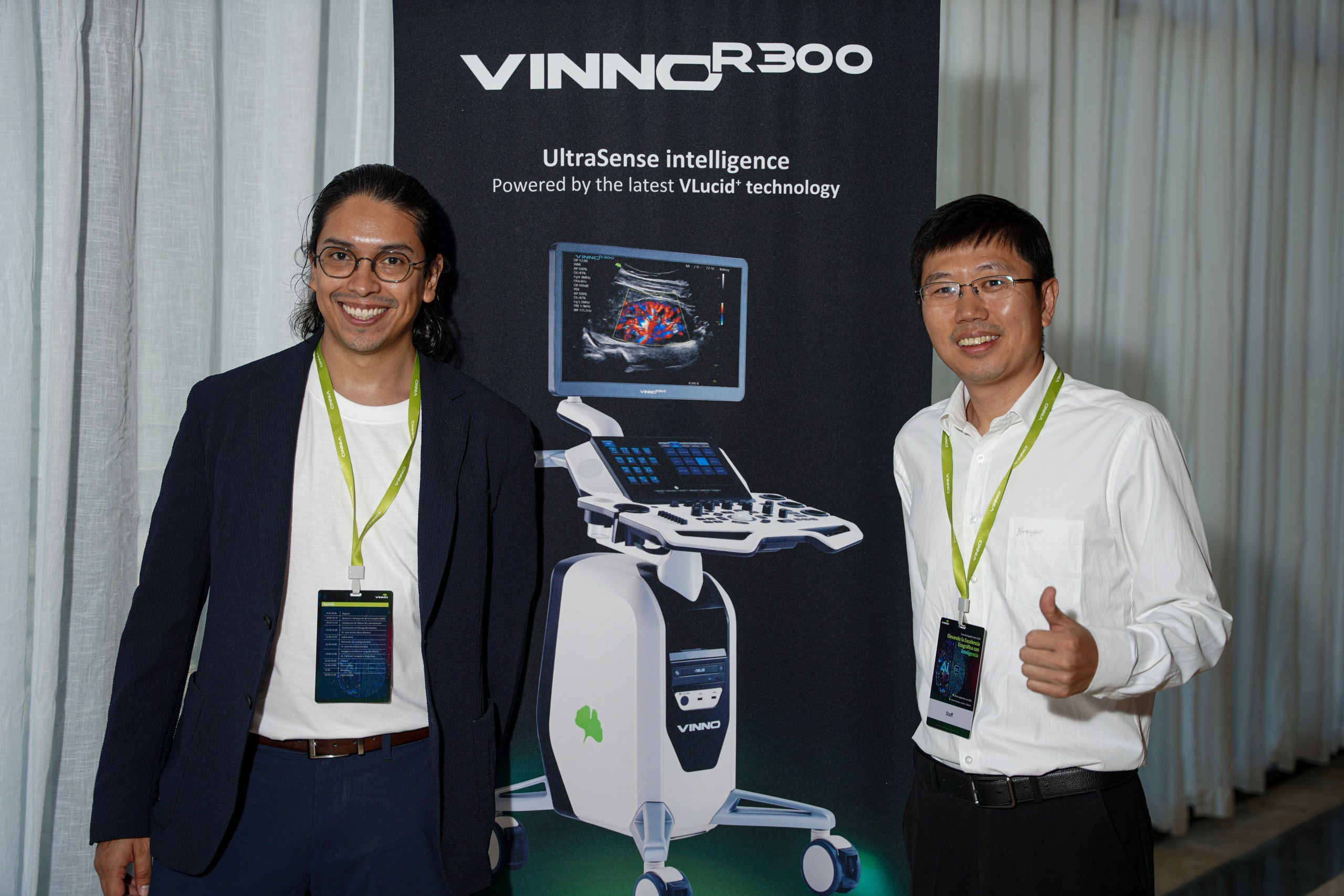 Technician demonstrating advanced features on new diagnostic device.