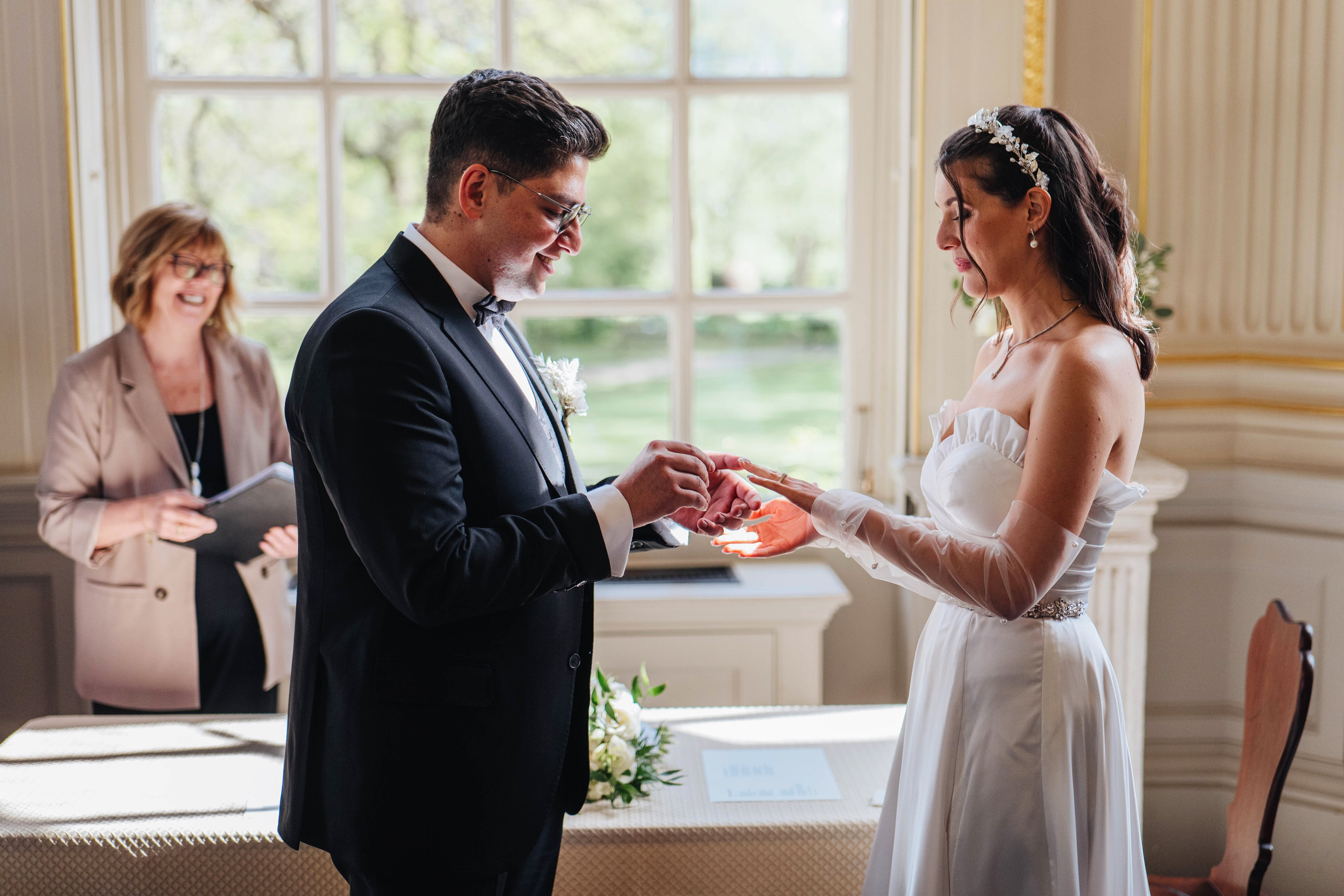 photo of the wedding ceremony, bride and groom exchanging rings