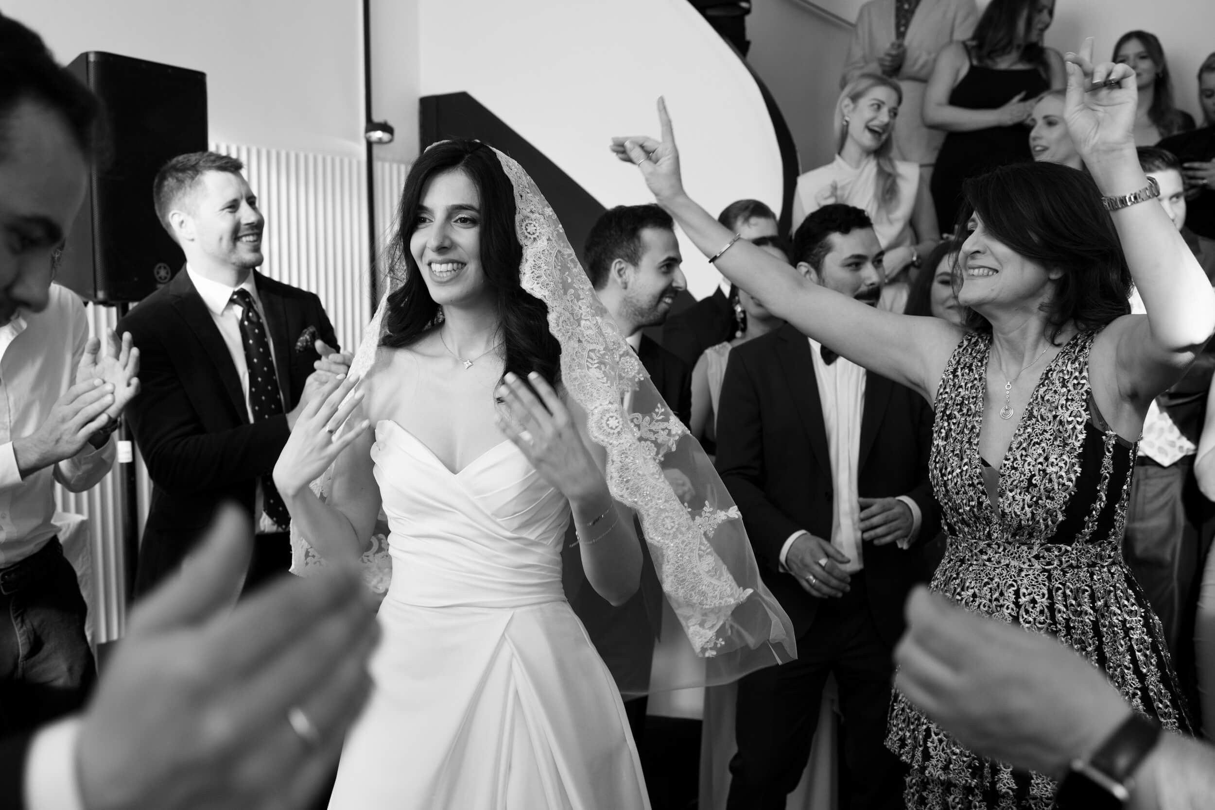 Black and white photo of the bride and groom during their first dance at the reception, romantic wedding dance at Bayerischer Hof Munich by Inna Zaytseva