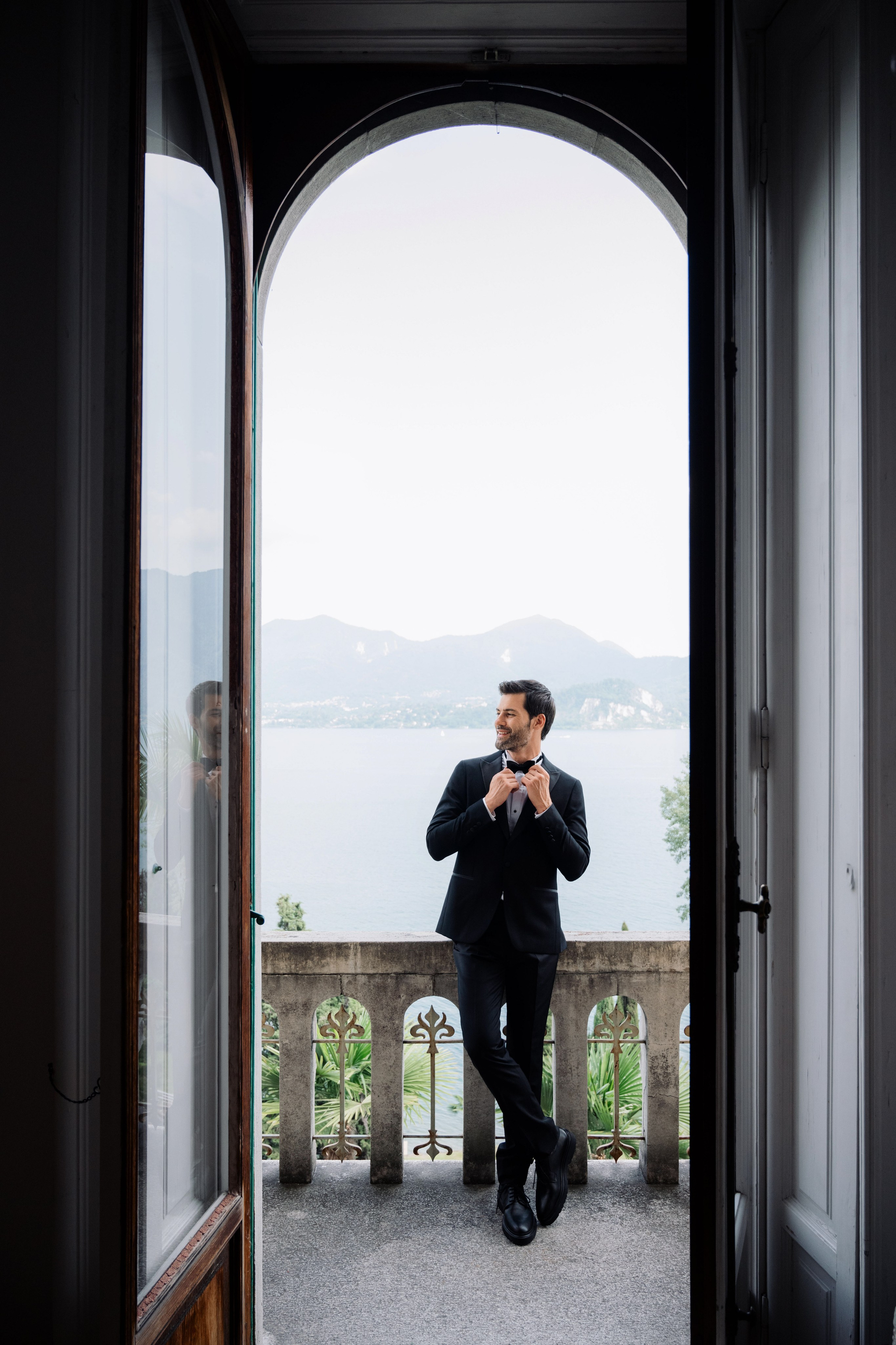 a man in a suit is taking a picture of himself