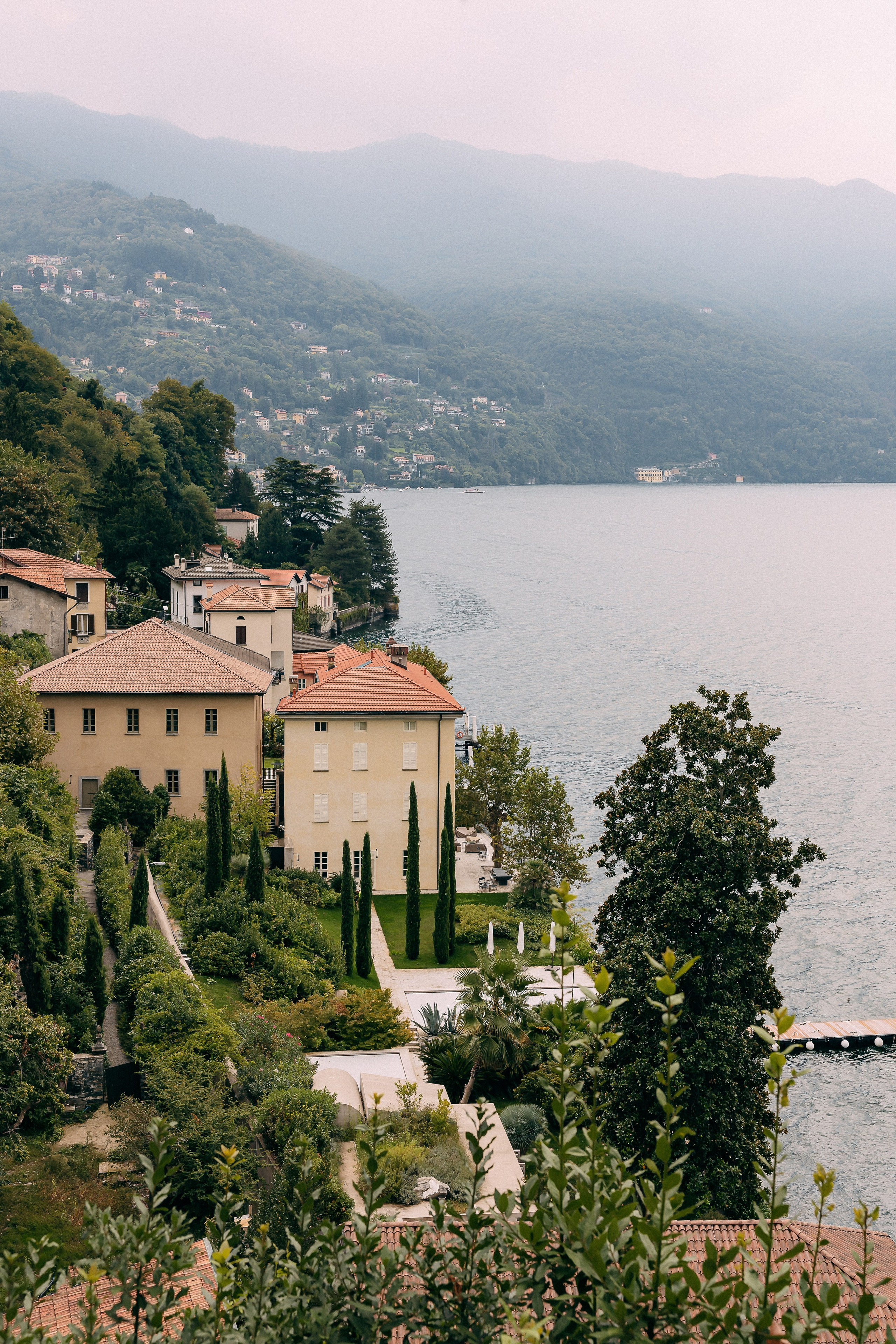 Lake Como wedding photographer capturing Villa Lario amid lush hillside gardens in Italy