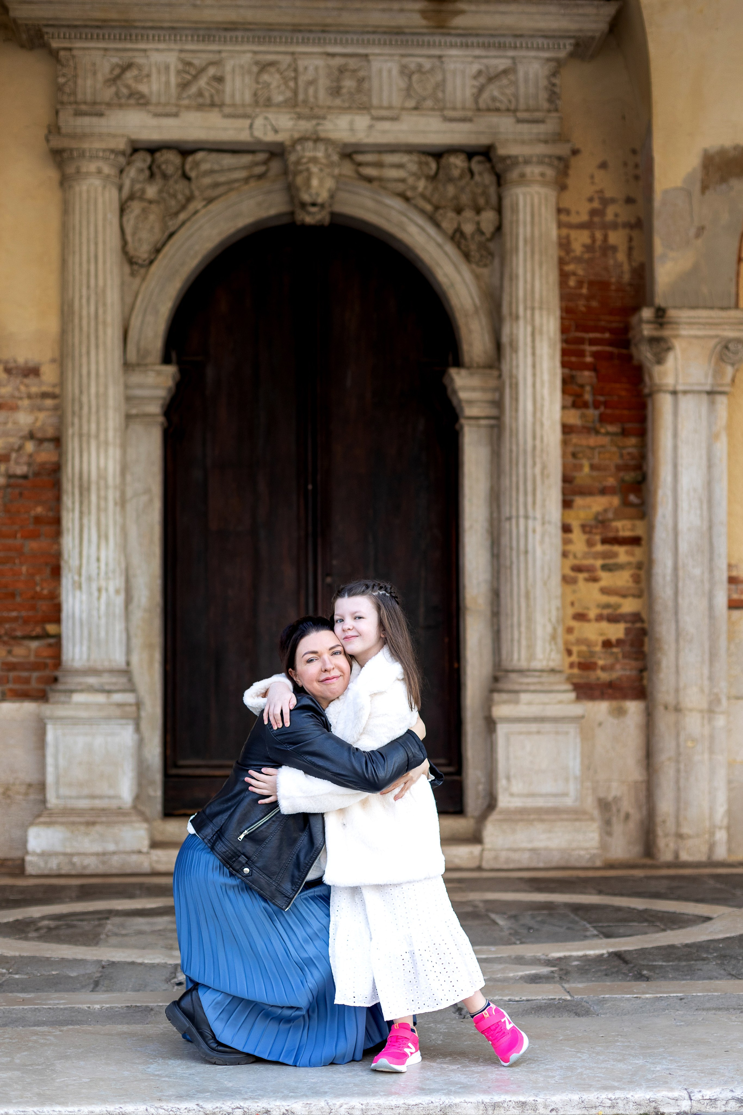 Mother and daughter at sunrise