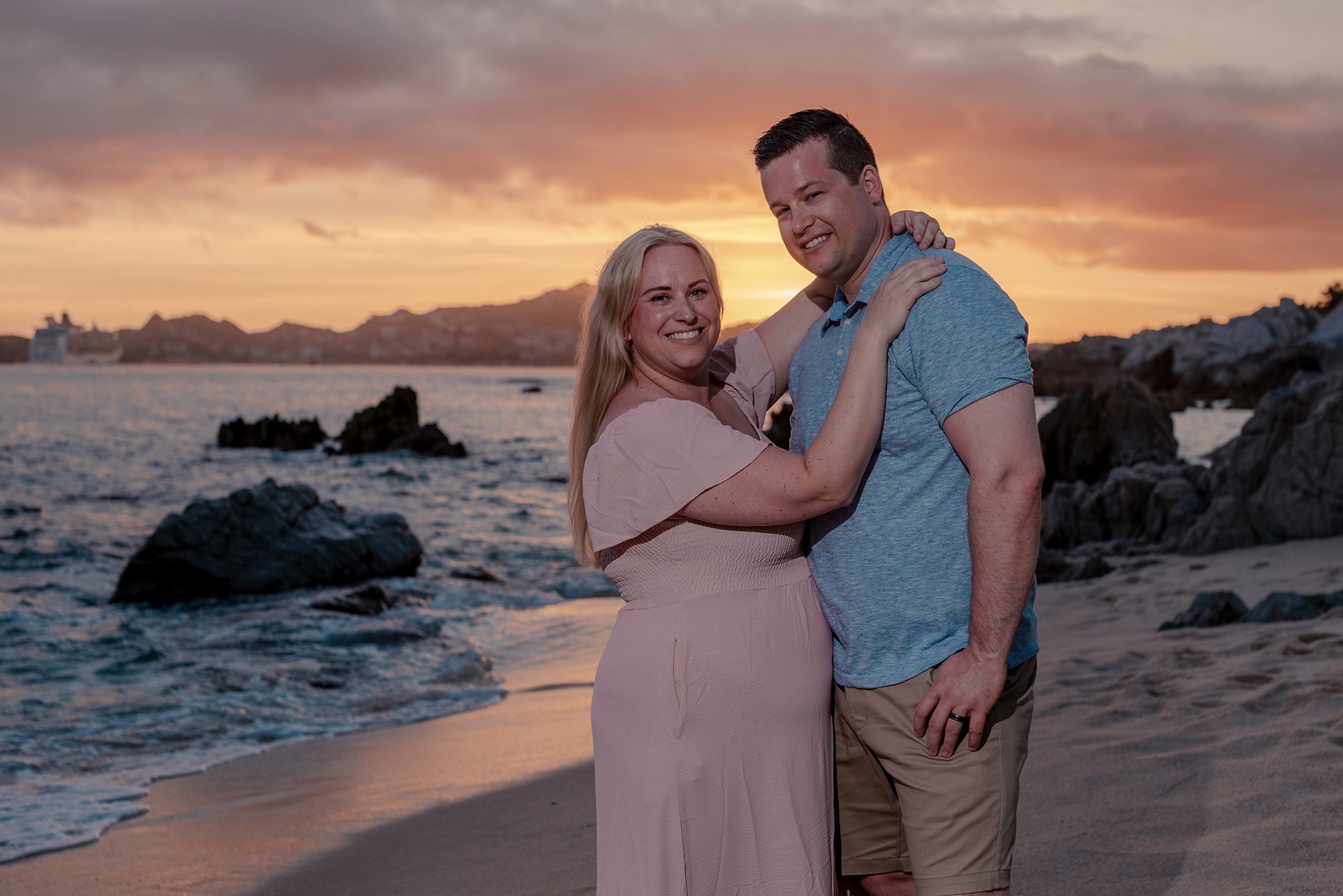 Candid family photo session near El Arco at Playa Monumentos Cabo San Lucas with natural rock formations and warm light