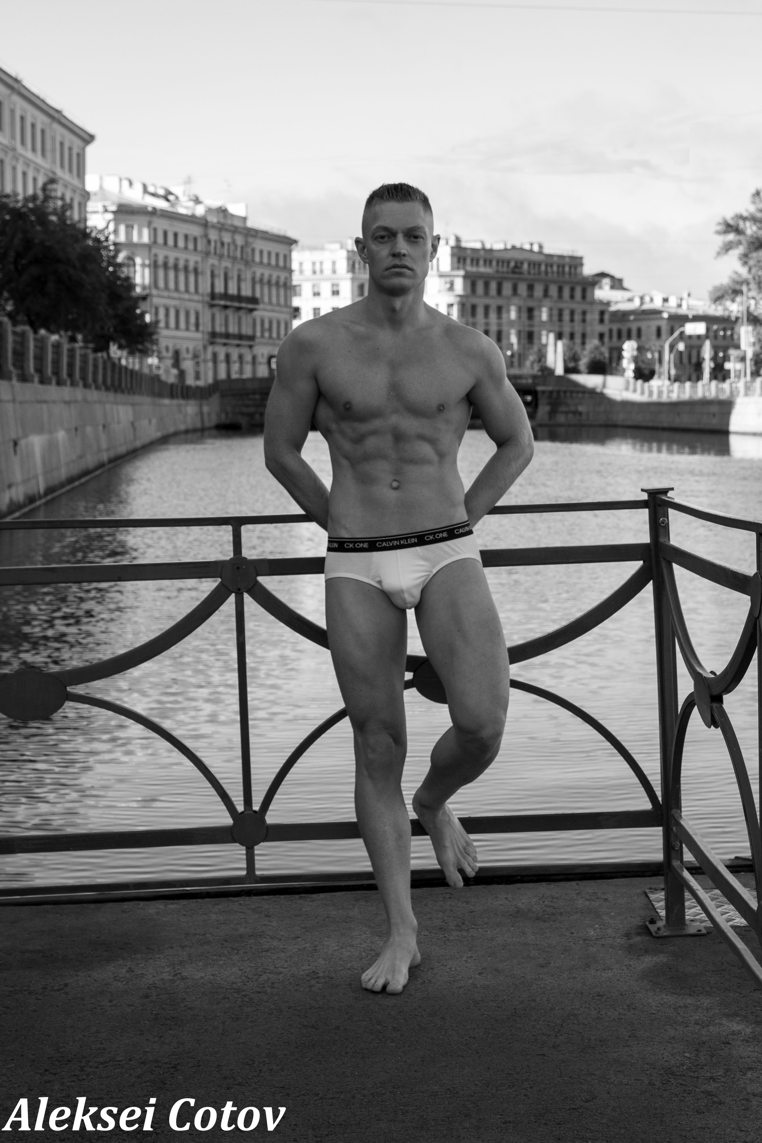 young guy by the river in underwear