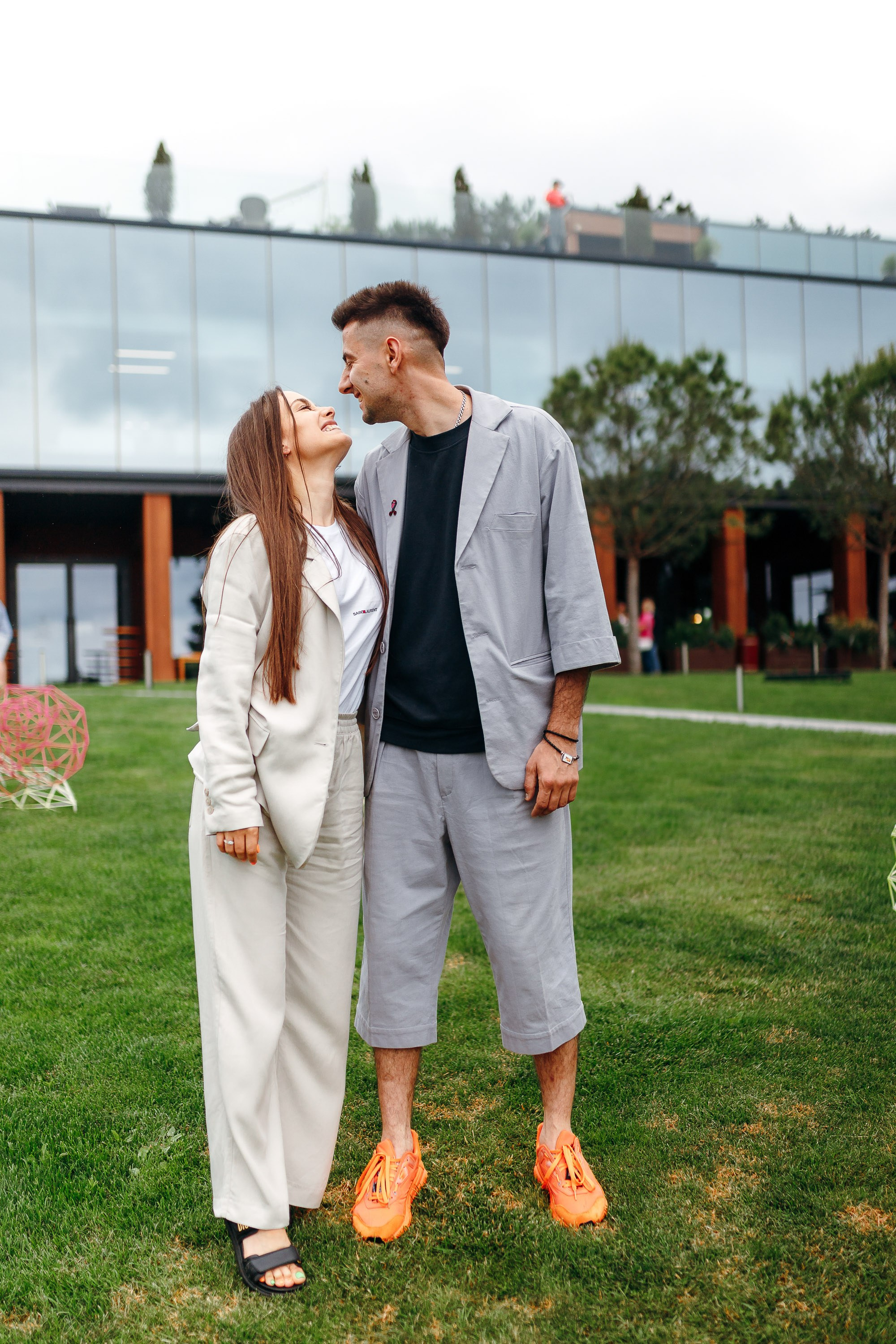Couple smiling together in park, casual portrait