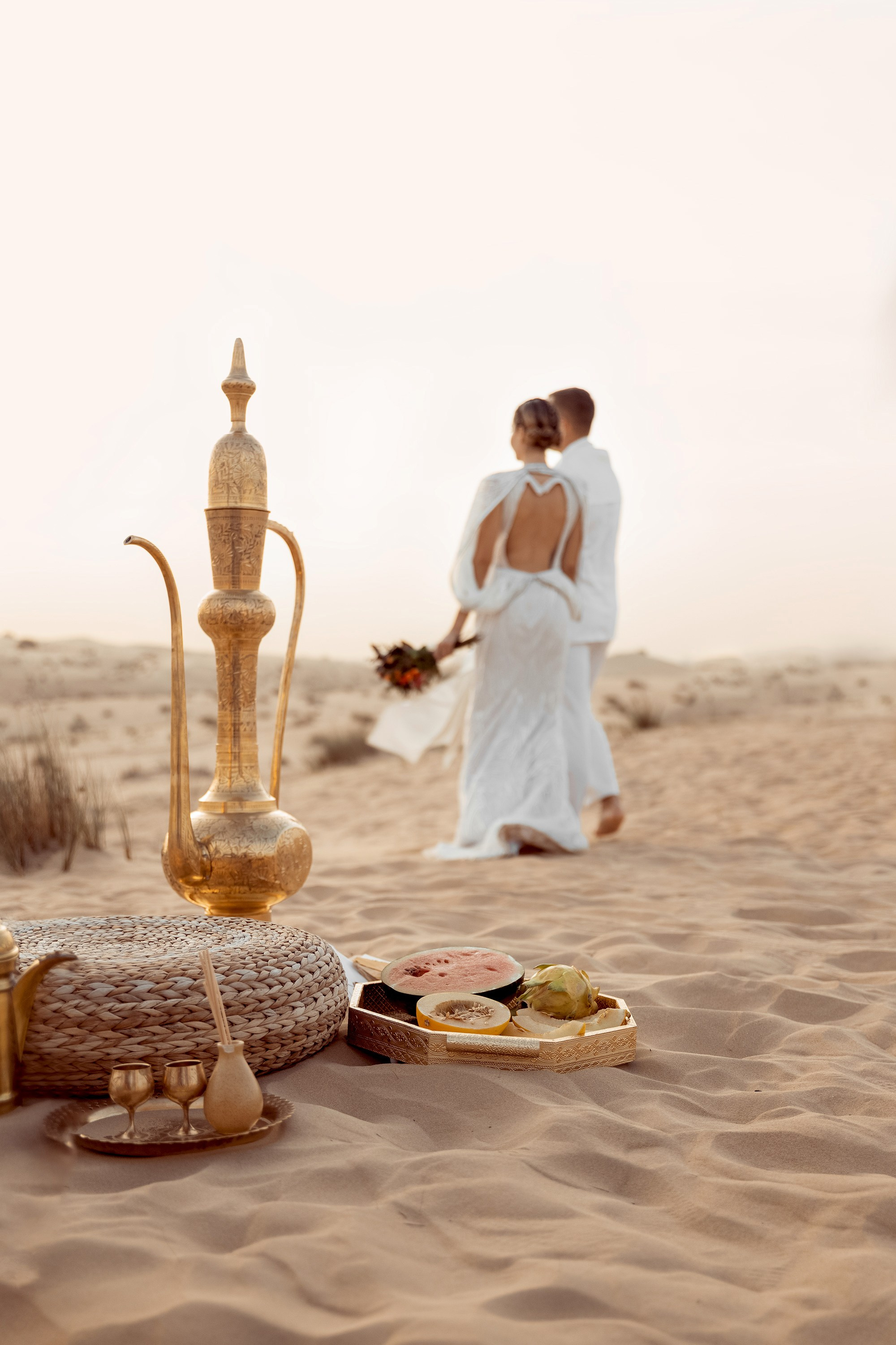 Bride and groom are walking away  after the ceremony is finished. Dubai, United Arab Emirates
