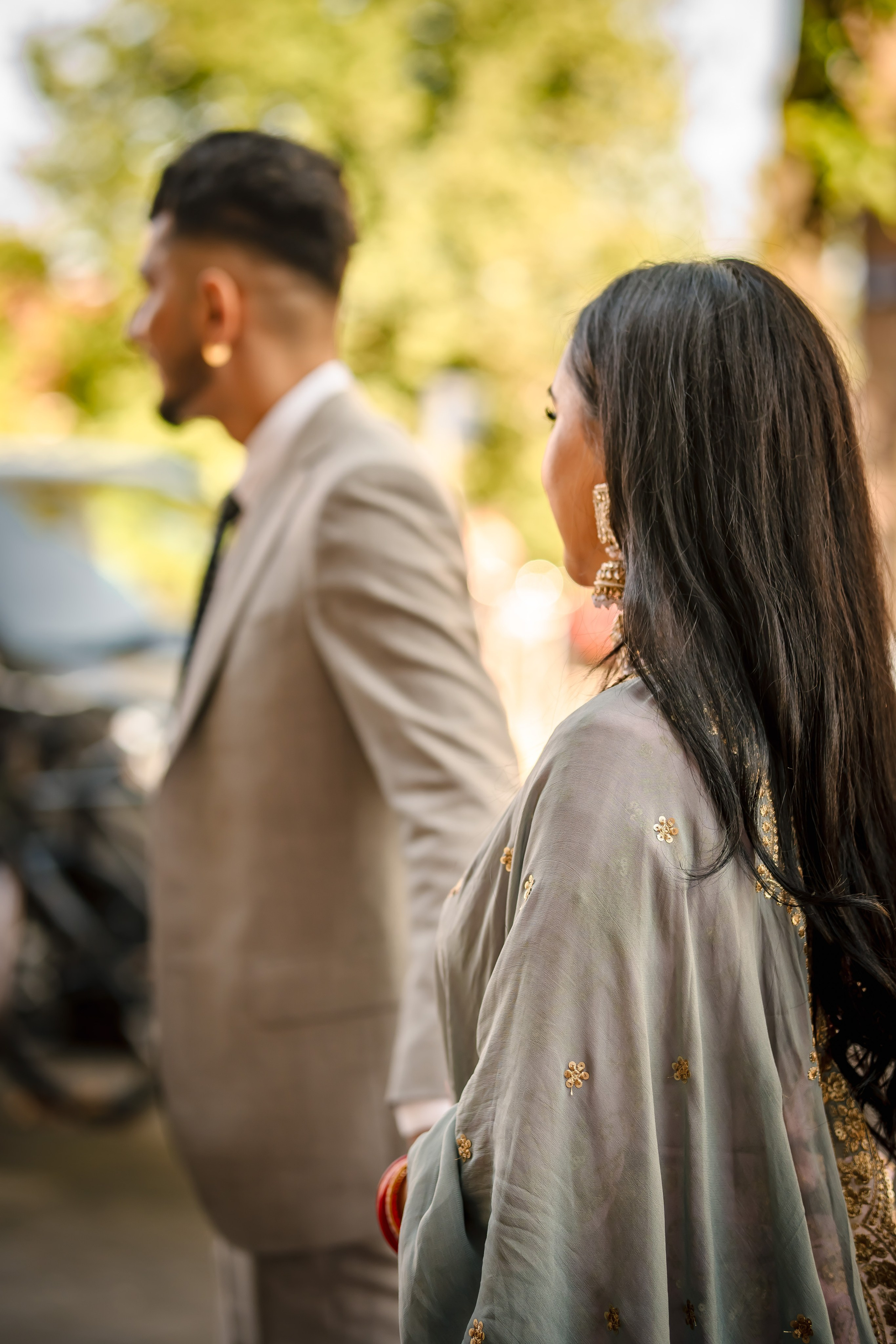 a groom walking with the bride