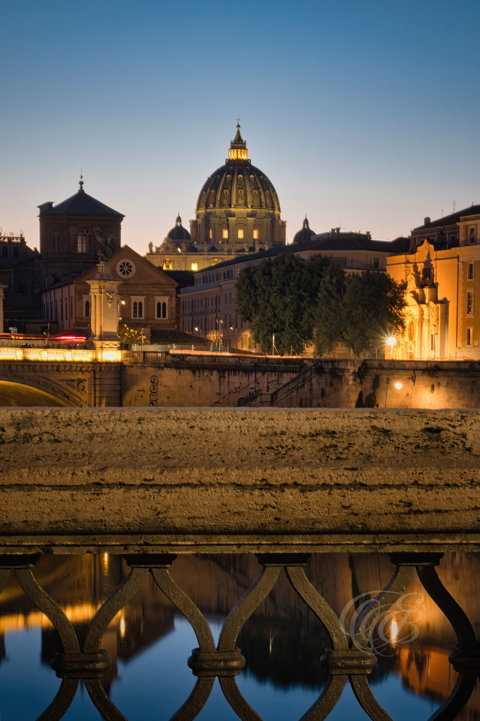 Rome, Italy – St. Peter’s Basilica is bathed in the warm hues of sunset in this fine art photograph. The golden light accentuates the grandeur of the iconic dome, creating a breathtaking contrast against the evening sky. A timeless piece capturing the beauty of one of Rome’s most revered landmarks. Eduardo Bartoli Photography.