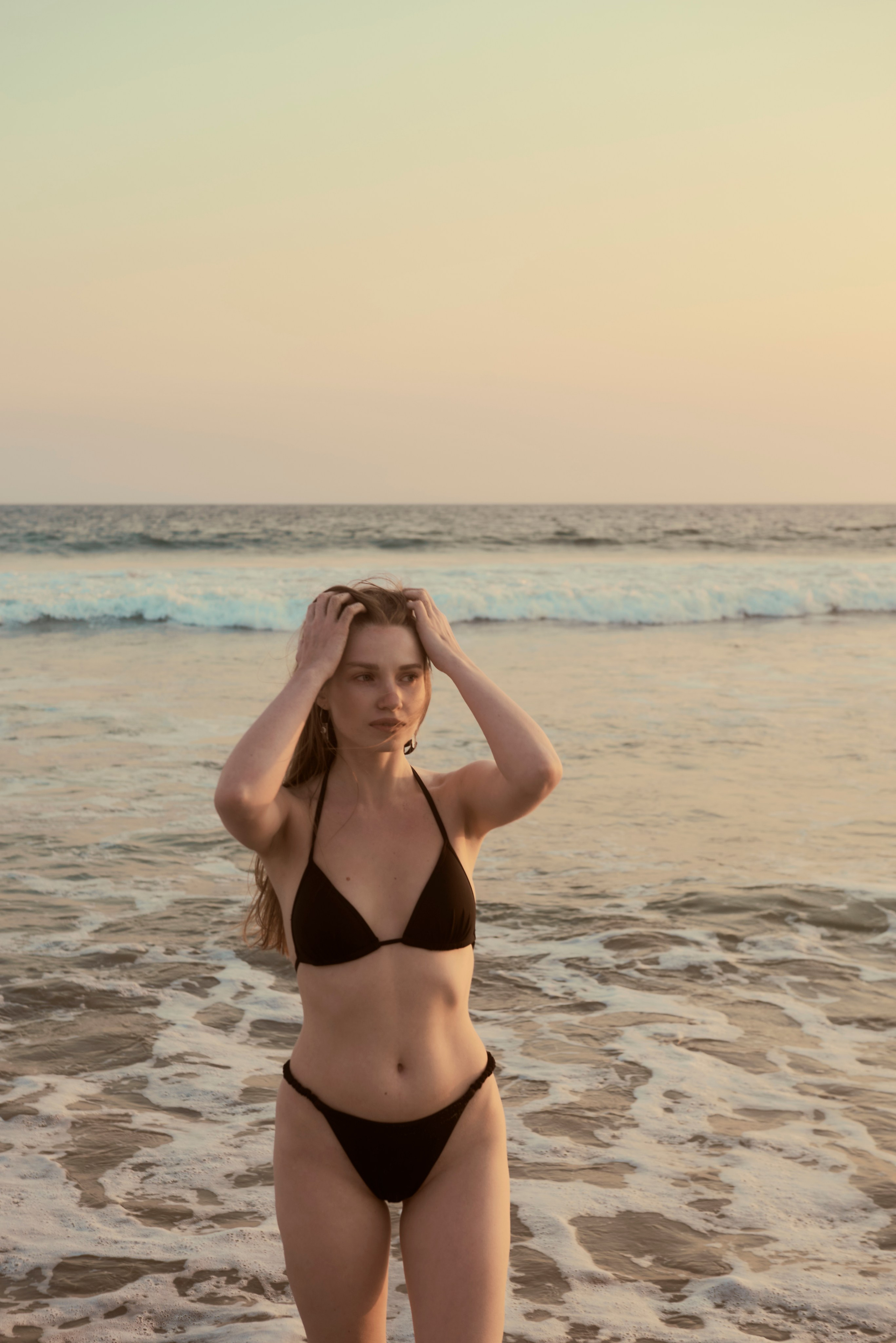 Santa Monica Beach: waves and golden rays behind the model