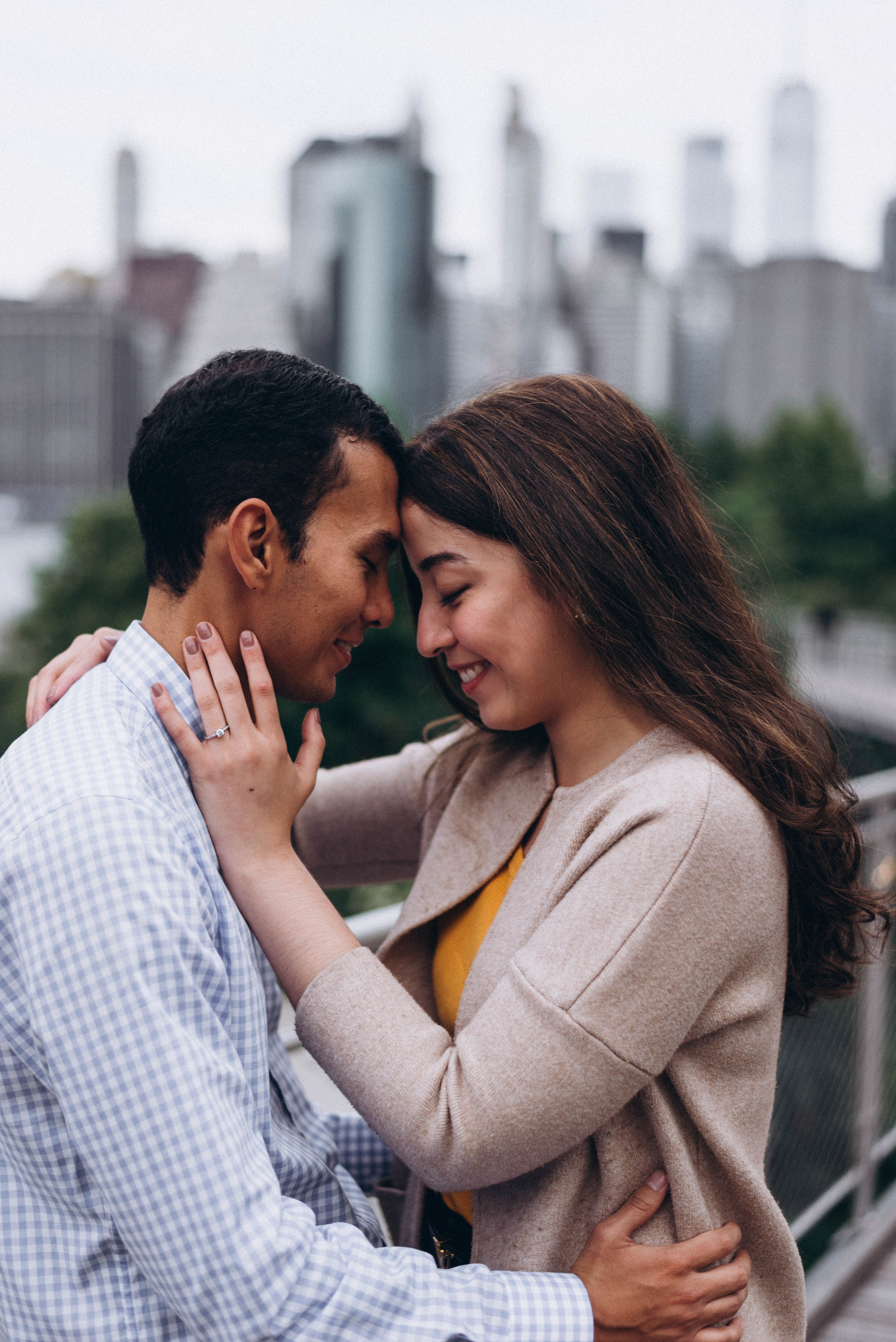 Proposal near Empire State Building lit at night.