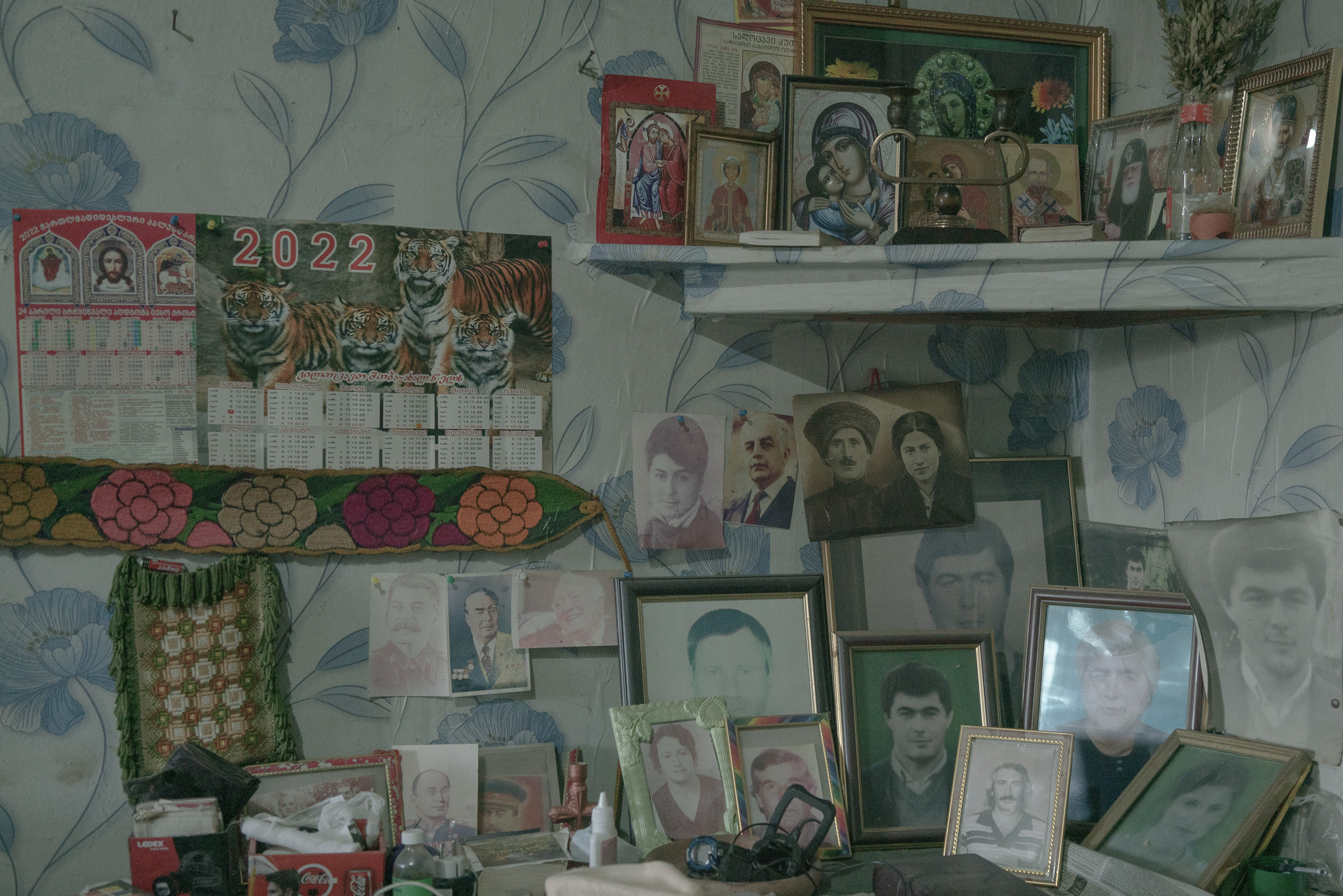 «Altar of the Dead» in the room of Yuri Chakvetadze, Tskaltubo, Georgia. January 22, 2023.There are two altars in Yuri’s room: the altar of the living and the altar of the dead. On the altar of the dead, Yuri has photographs of his wife, eldest son, parents, Joseph Stalin, Brezhnev, Beria, Shevardnadze and icons. Yuri is nostalgic for the Soviet Union, he says that they lived all together then, but once everything broke up ”brothers became enemies”.