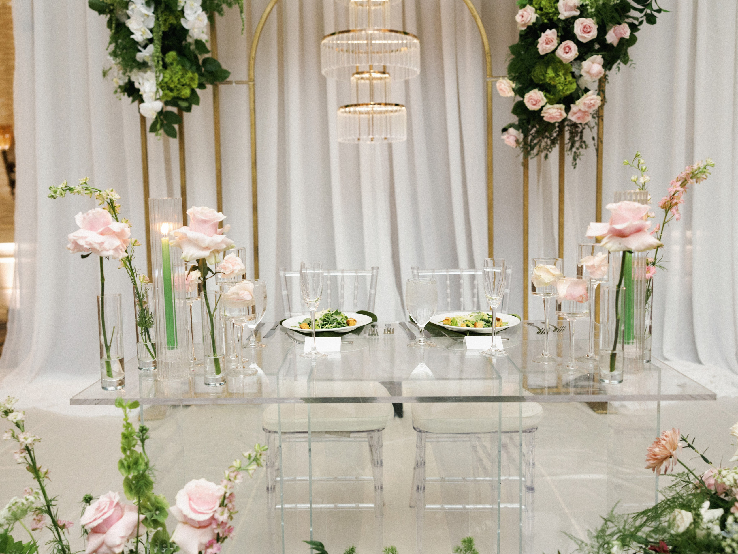 Elegant wedding reception table with candles and white florals