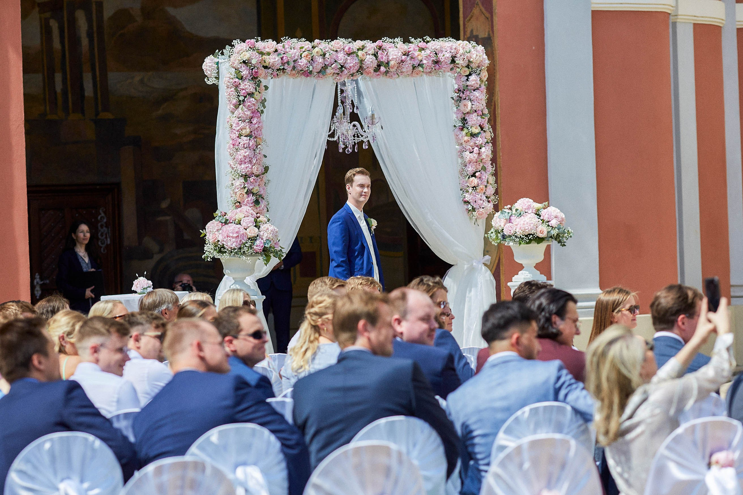 Matthias looks on as the bridal party makes its way.