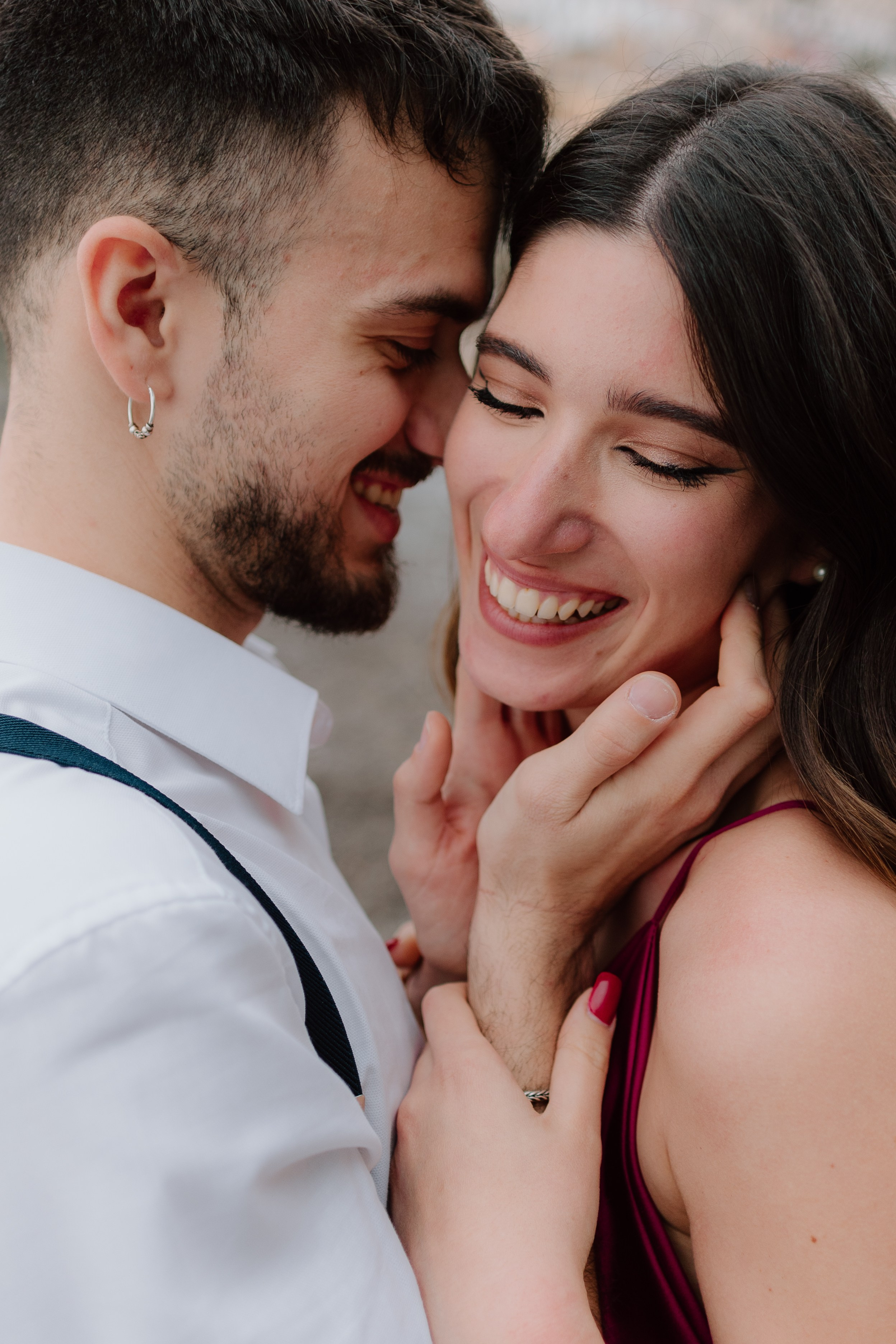 A couple smiling together on a Positano beach.