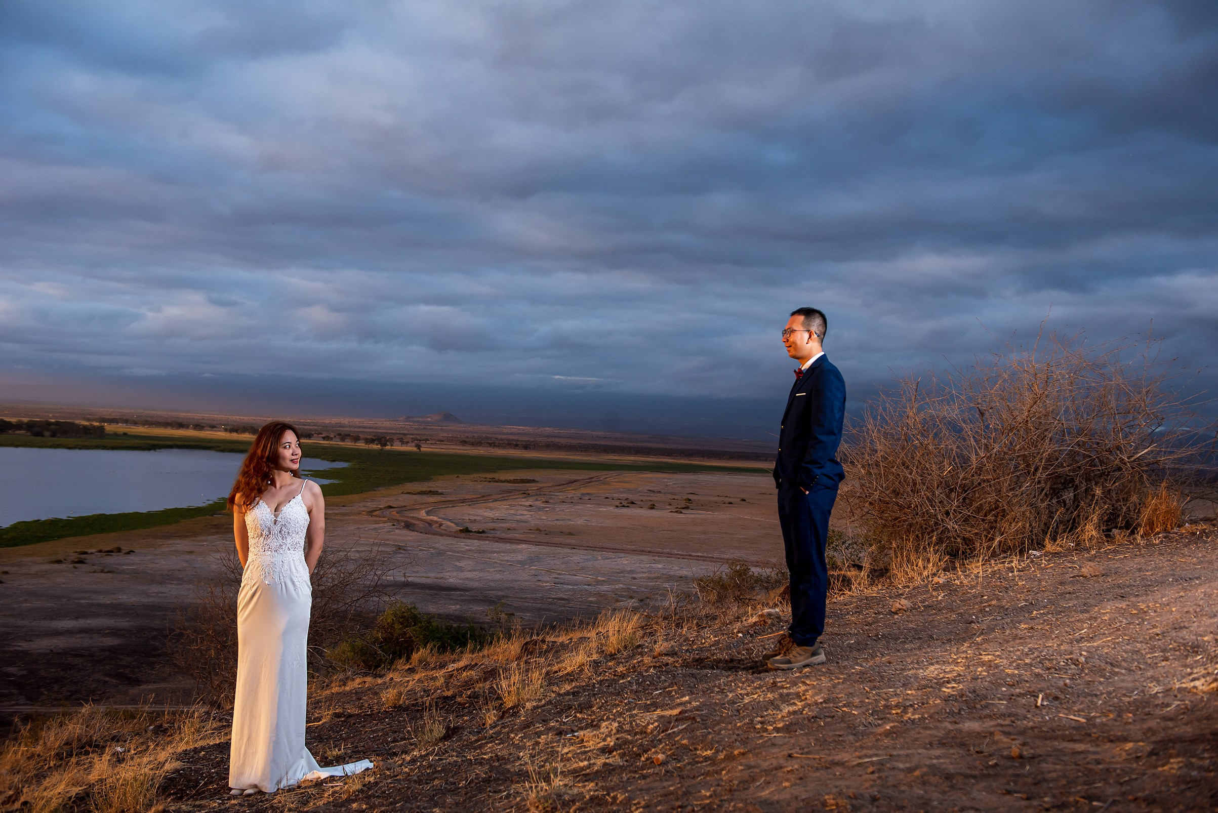 Golden hour bride and groom portrait at their destination wedding in Amboseli National Park