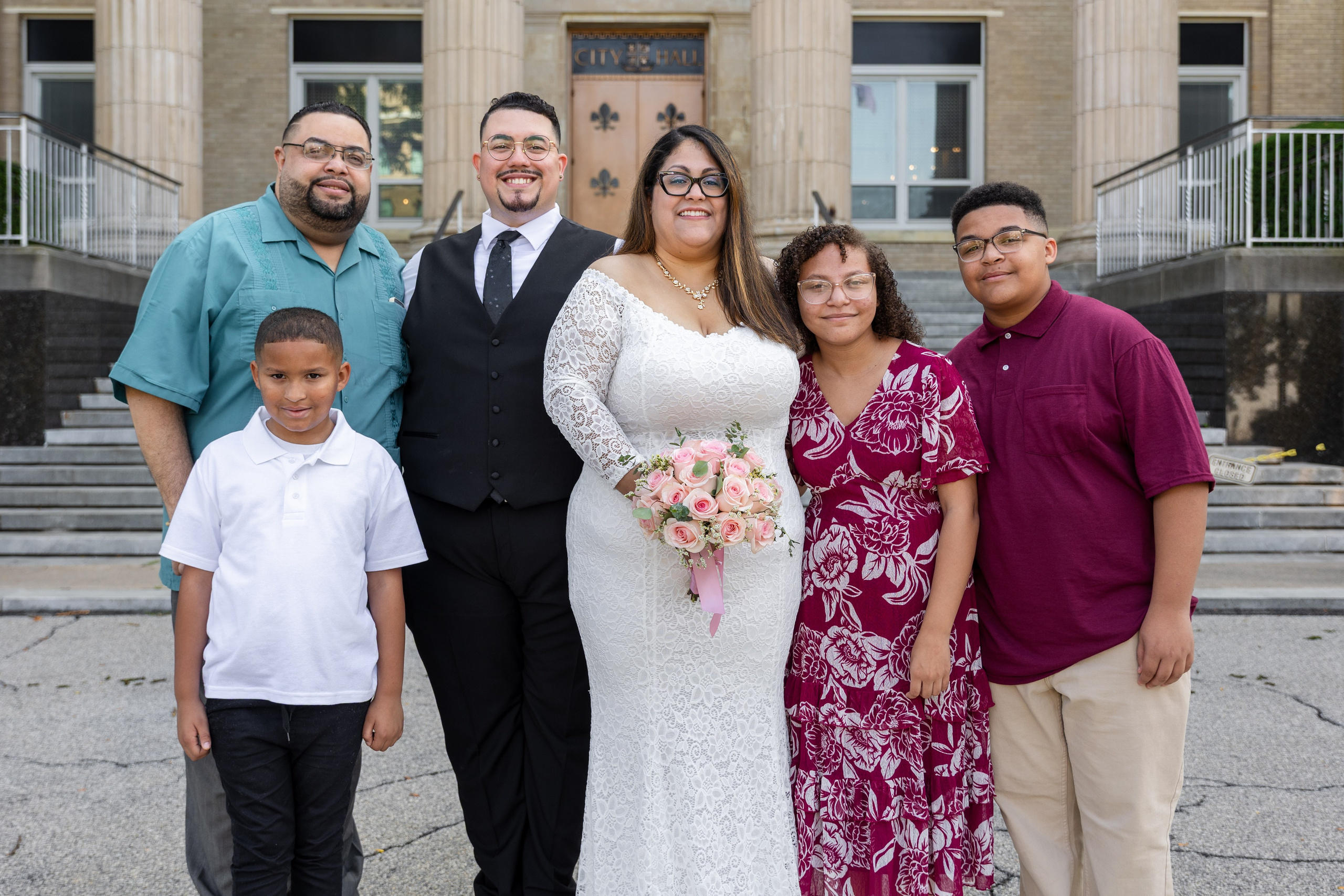 Bride and groom celebrating their marriage surrounded by family and friends