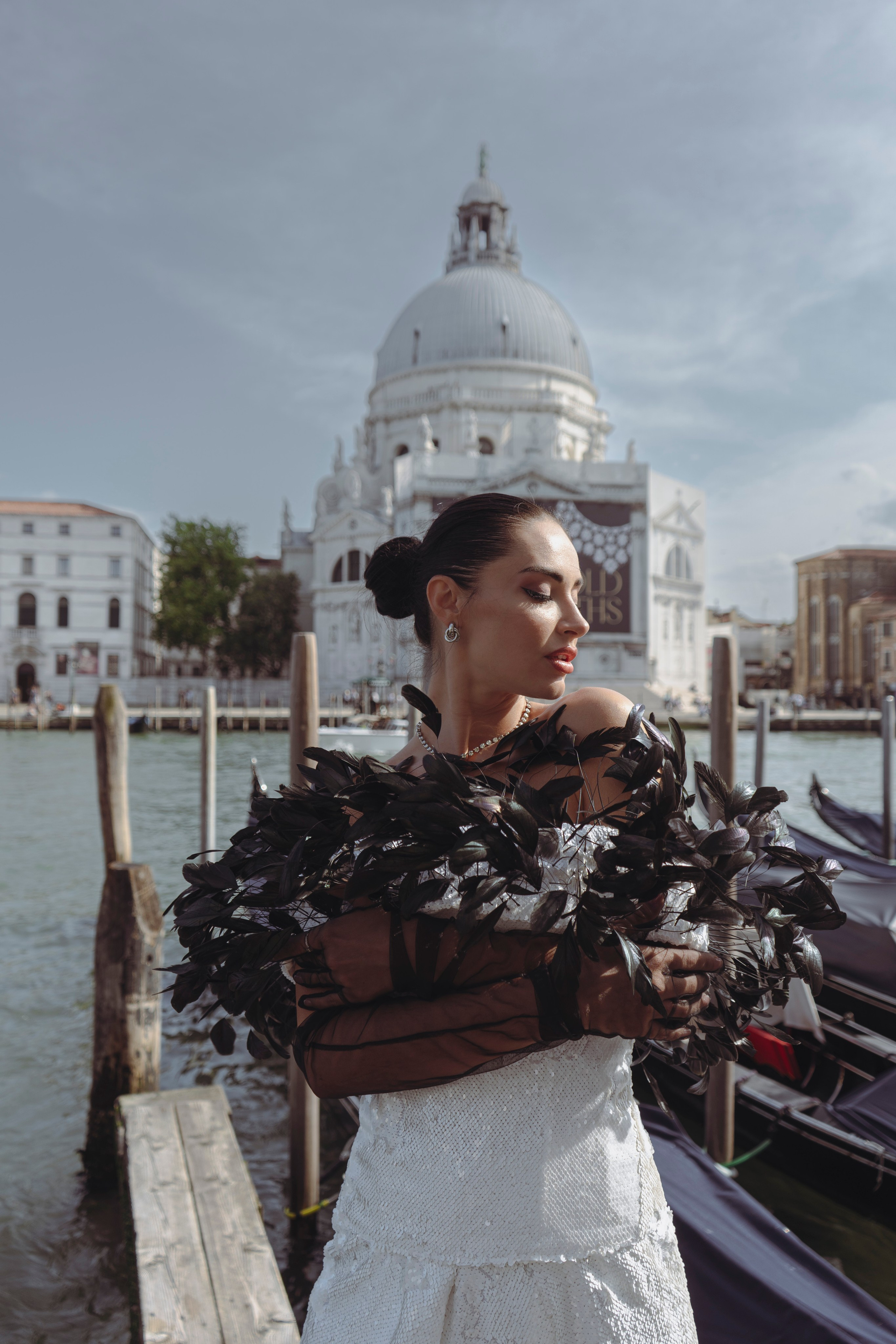 Fashion shoot in Venice with elegant Italian styling and gondolas in the background.