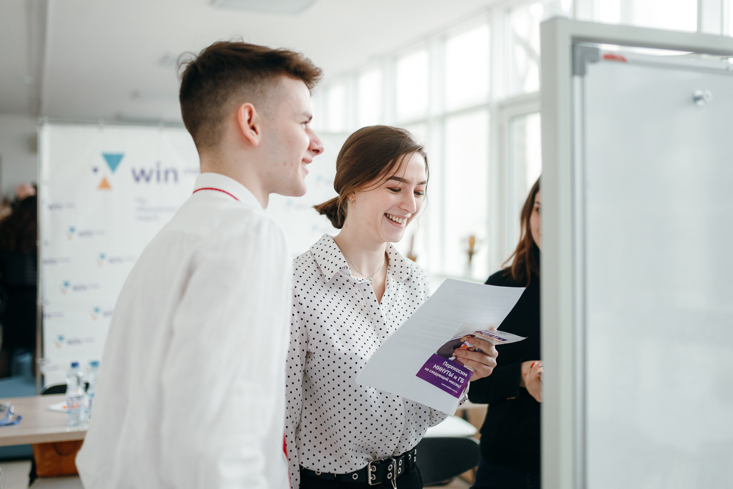 Team working at whiteboard, office brainstorming session