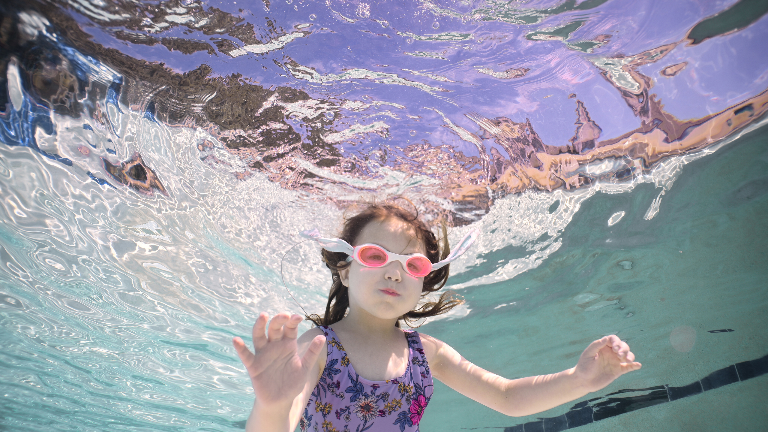 Olga and family underwater. Family and Sports photographer in Cary Raleigh NC North Carolina