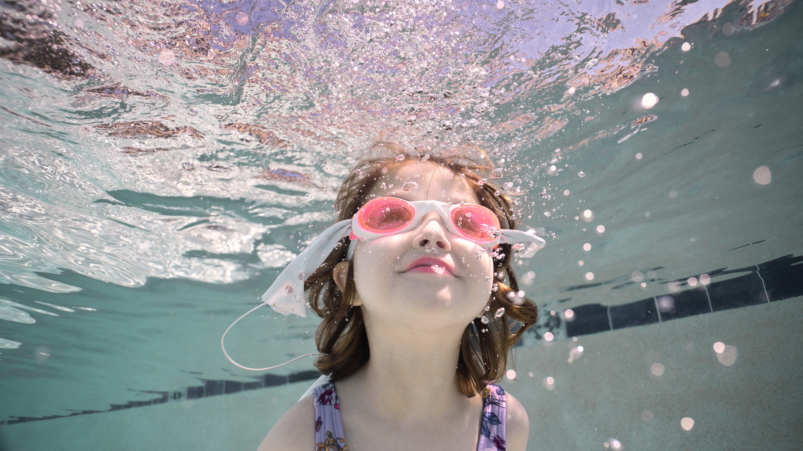 Olga and family underwater. Family and Sports photographer in Cary Raleigh NC North Carolina