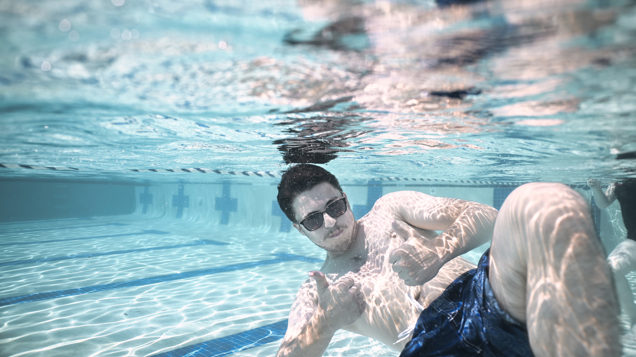 Olga and family underwater. Family and Sports photographer in Cary Raleigh NC North Carolina
