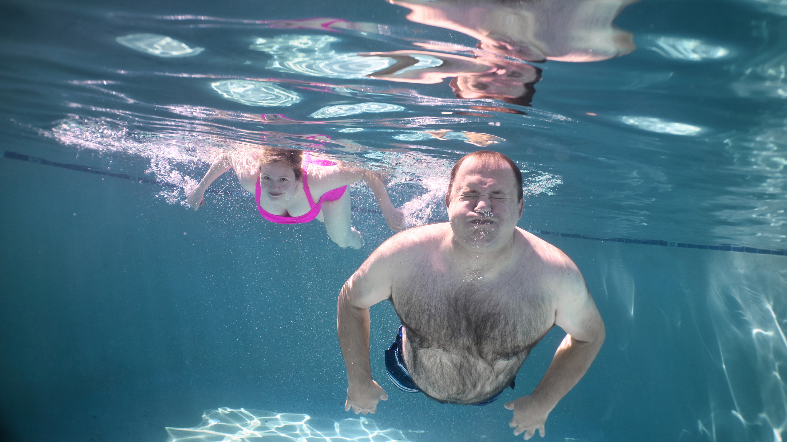 Olga and family underwater. Family and Sports photographer in Cary Raleigh NC North Carolina