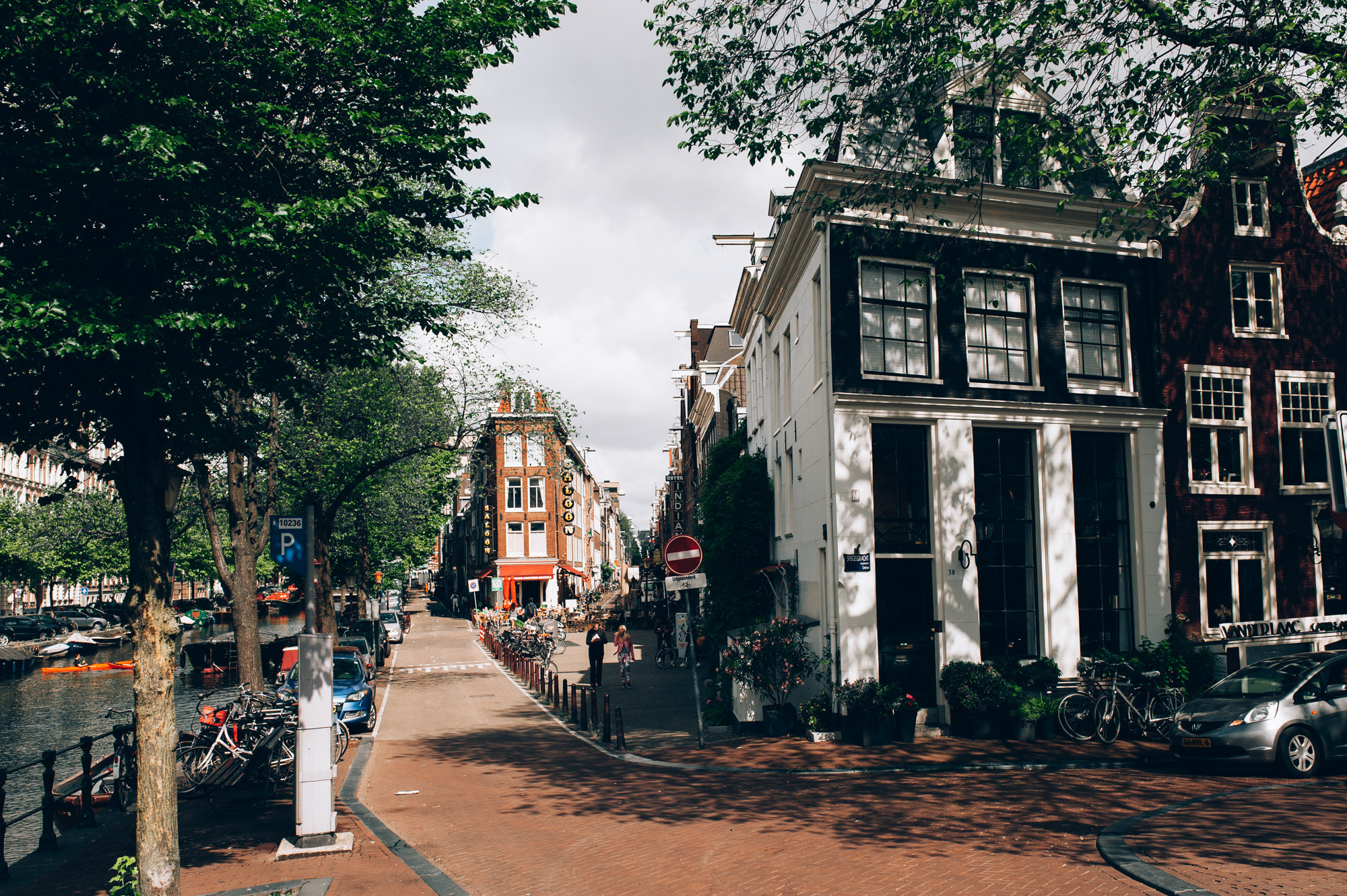 a street with a row of parked cars