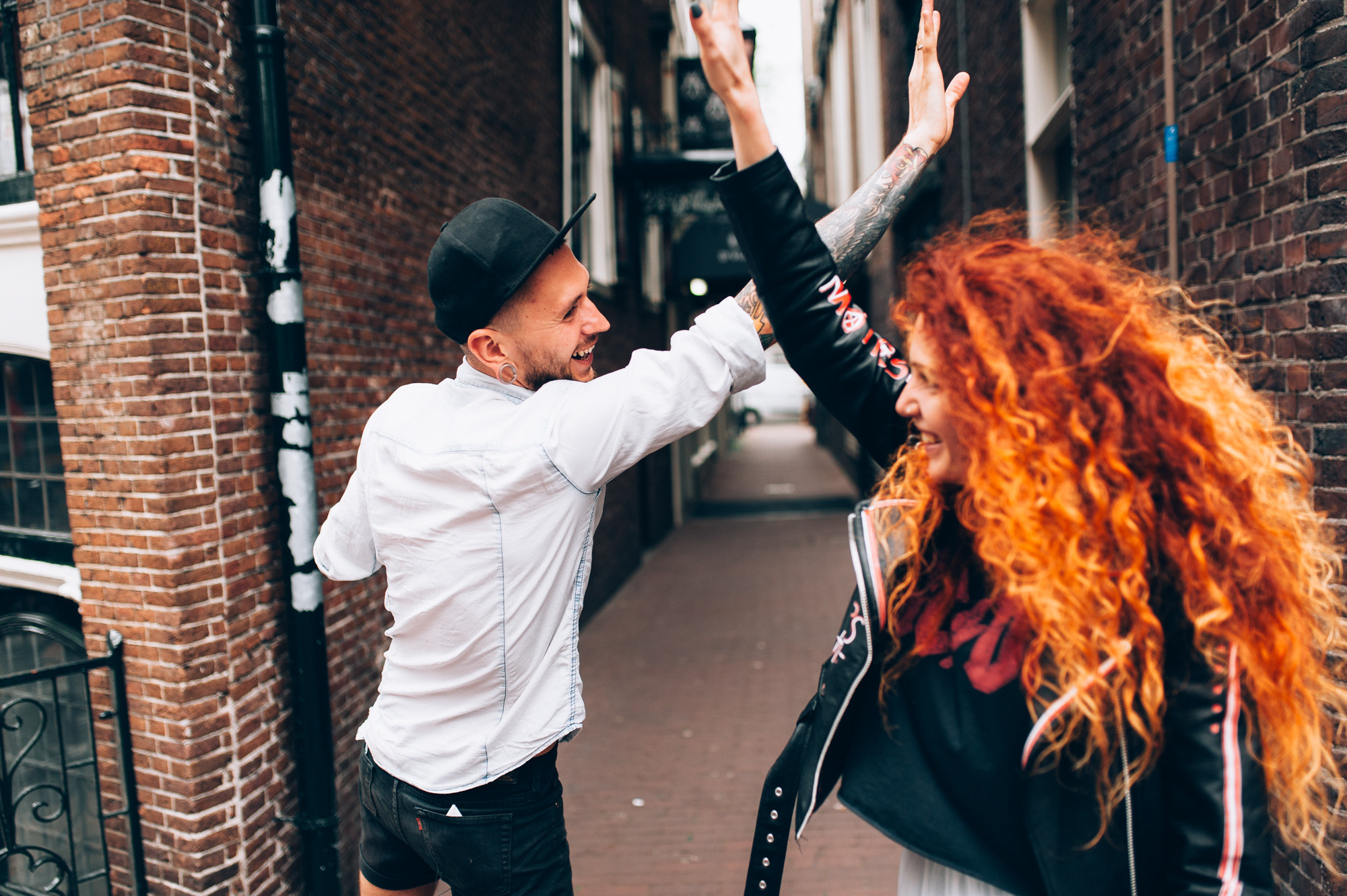 a man and woman dancing in the street