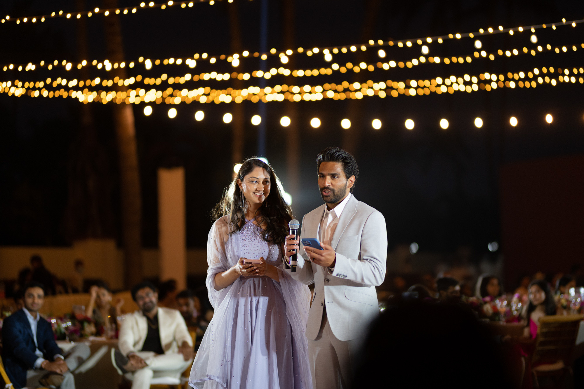 a man and woman standing next to each other people