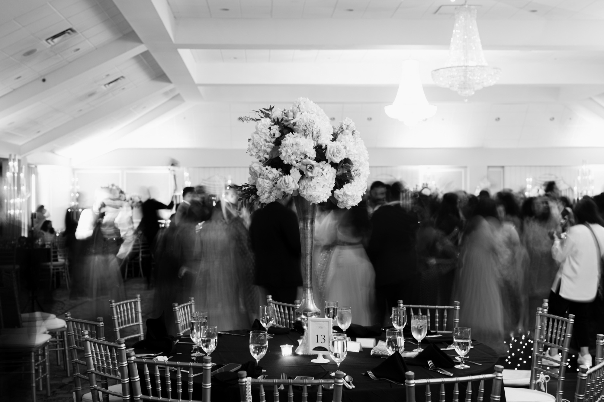 a black and white photo of a wedding reception