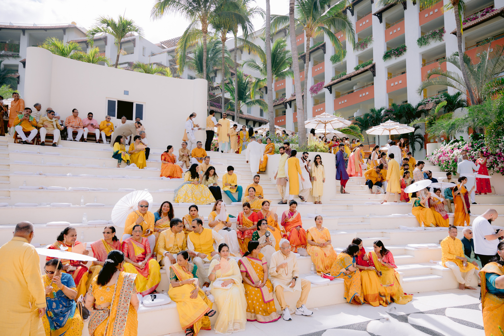 a group of people sitting on steps in front of a building