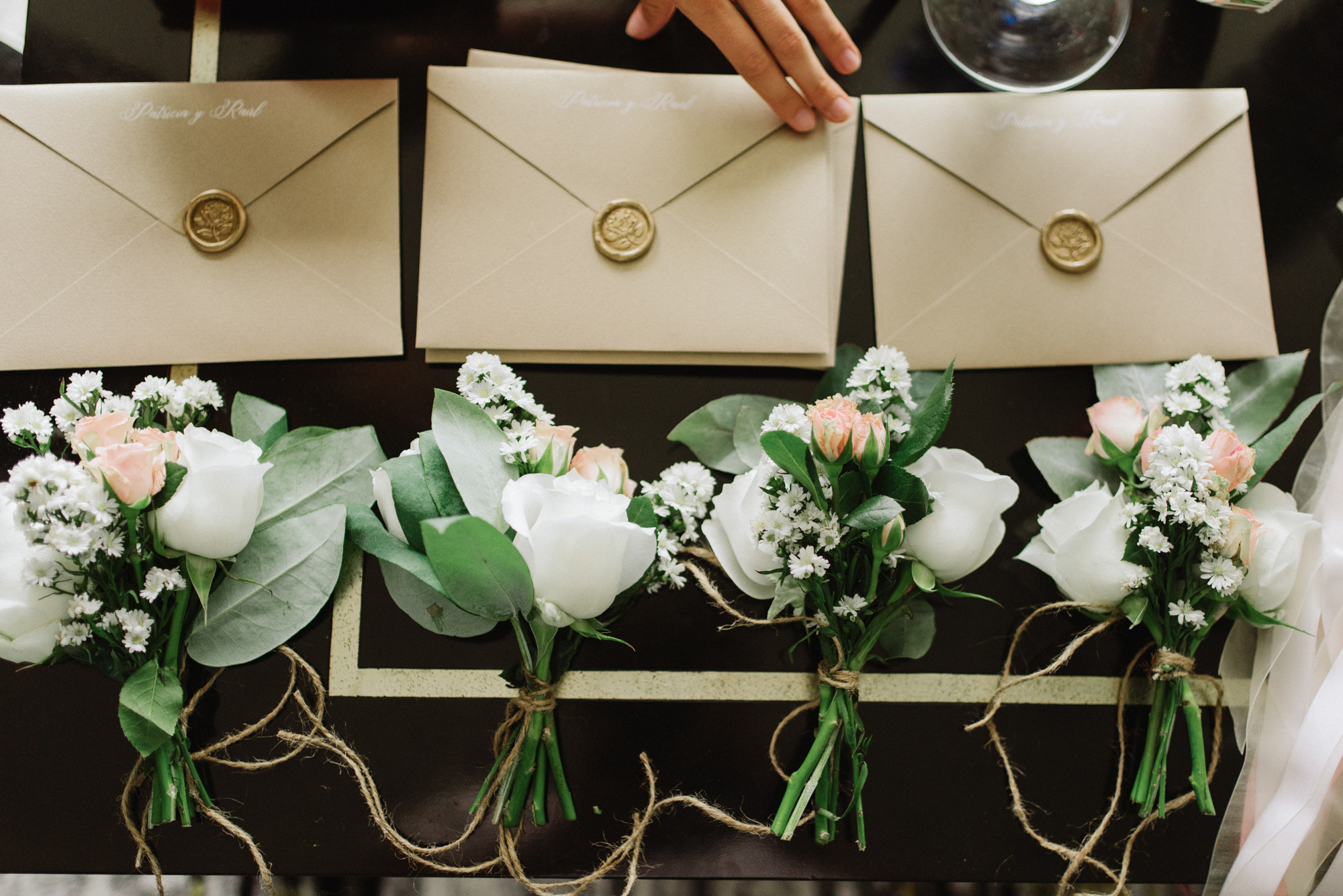 a couple of people holding flowers in their hands