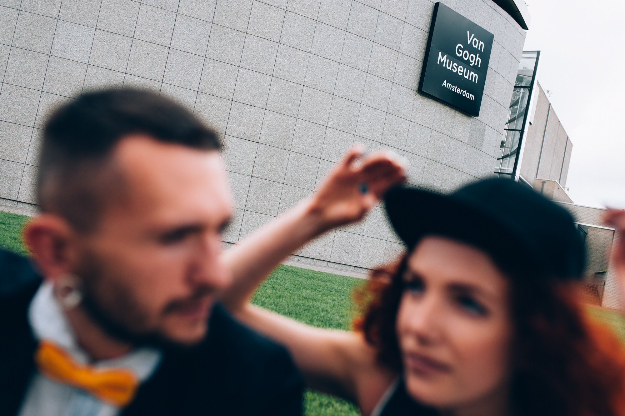 a man and woman are standing outside