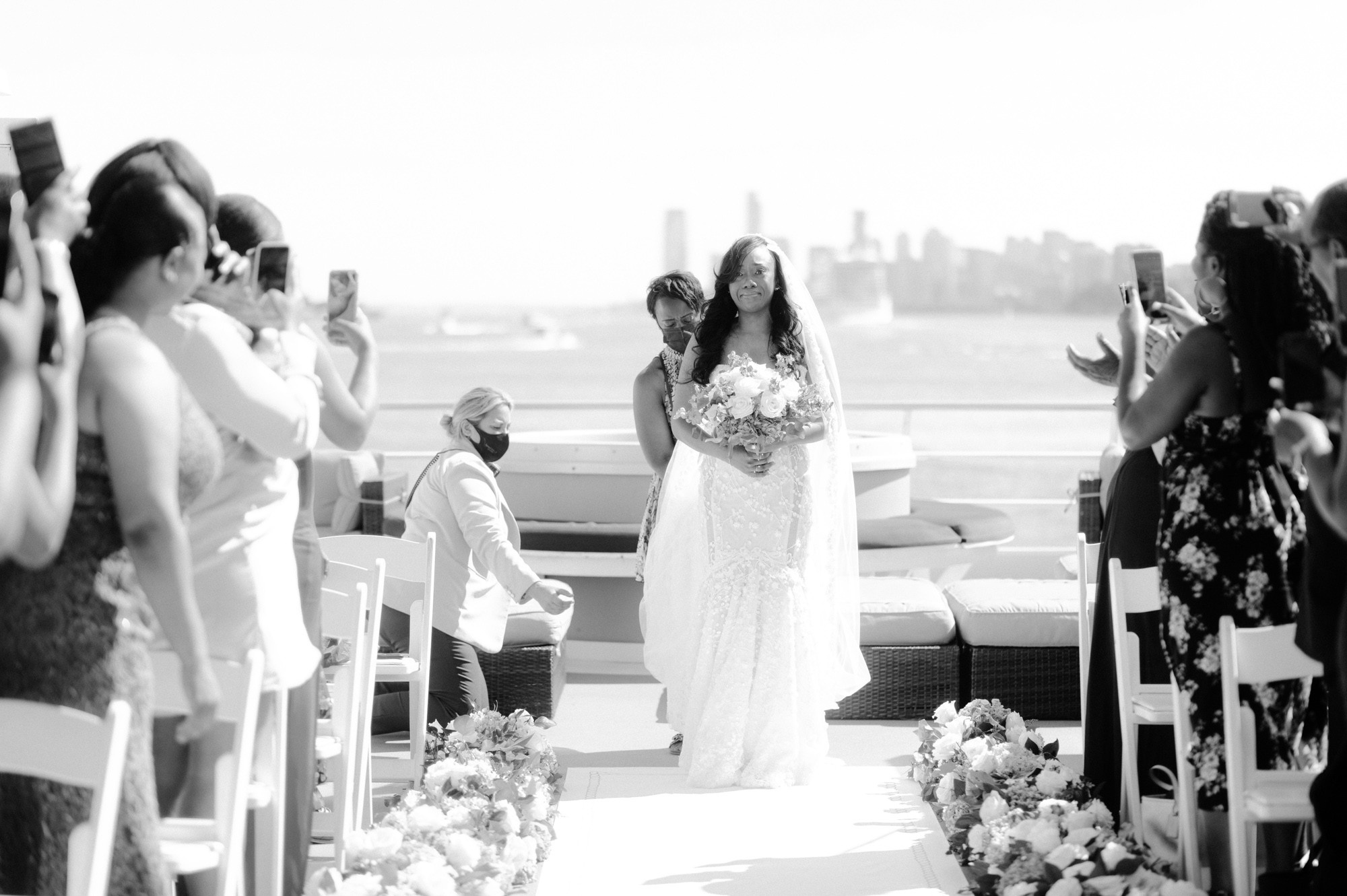 a bride and groom walking down the aisle