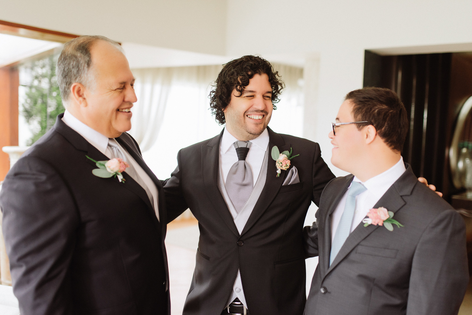 grooms laughing at the wedding