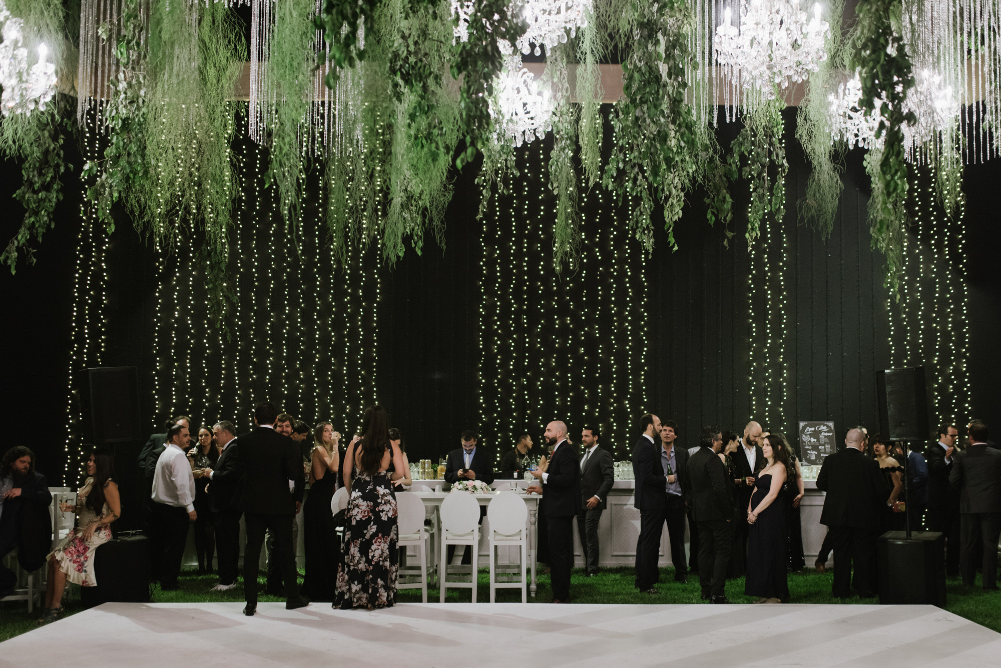a group of people standing around a table