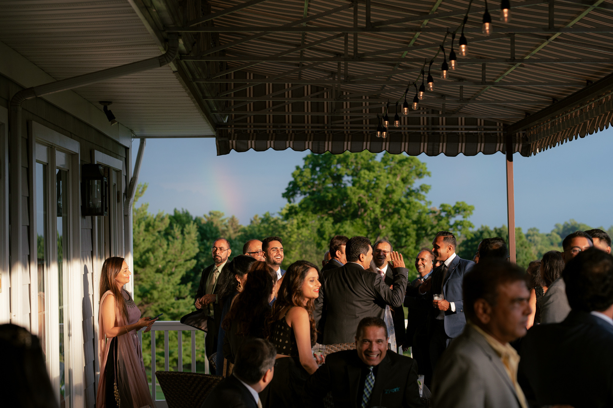 a group of people standing on a porch
